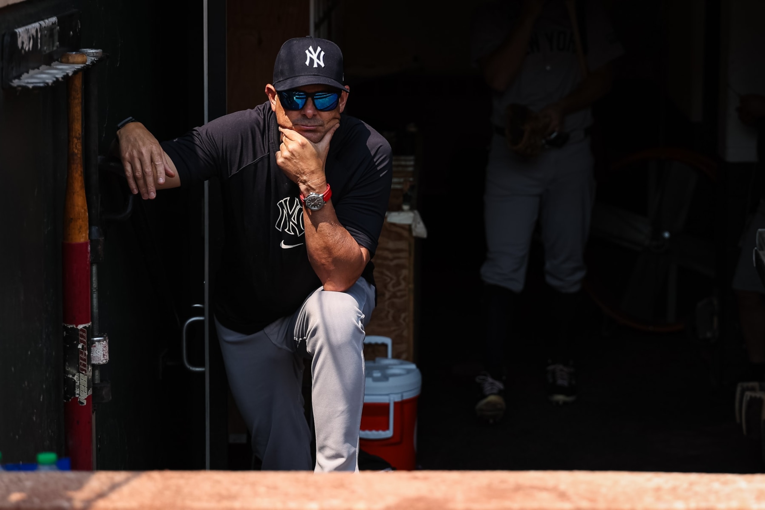 BALTIMORE, MD - JULY 14: Manager Aaron Boone #17 of the New York Yankees looks on from the dugout steps before the game against the Baltimore Orioles at Oriole Park at Camden Yards on July 14, 2024 in Baltimore, Maryland. (Photo by Scott Taetsch/Getty Images) BALTIMORE, MD - JULY 14: Manager Aaron Boone #17 of the New York Yankees looks on from the dugout steps before the game against the Baltimore Orioles at Oriole Park at Camden Yards on July 14, 2024 in Baltimore, Maryland. (Photo by Scott Taetsch/Getty Images)