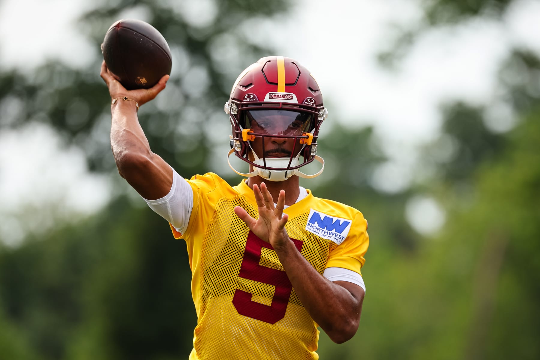 ASHBURN, VA - JULY 25: Jayden Daniels #5 of the Washington Commanders participates in a drill during training camp at OrthoVirginia Training Center at Commanders Park on July 25, 2024 in Ashburn, Virginia. (Photo by Scott Taetsch/Getty Images)