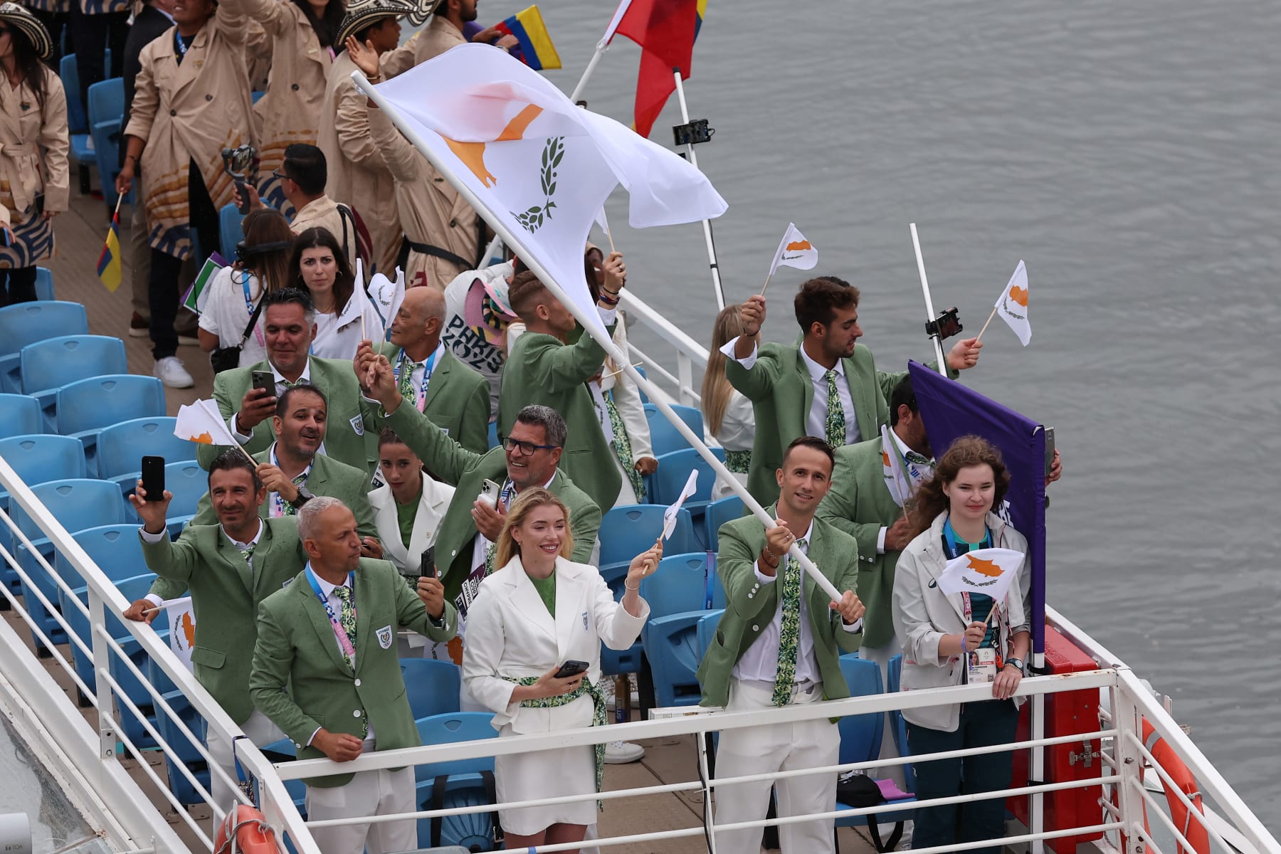 PARIS, FRANCE - JULY 26: Milan Trajkovic and Elena Kulichenko, Flagbearer of Team Cyprus, are seen on a boat on the River Seine during the opening ceremony of the Olympic Games Paris 2024 on July 26, 2024 in Paris, France. (Photo by Lars Baron/Getty Images)