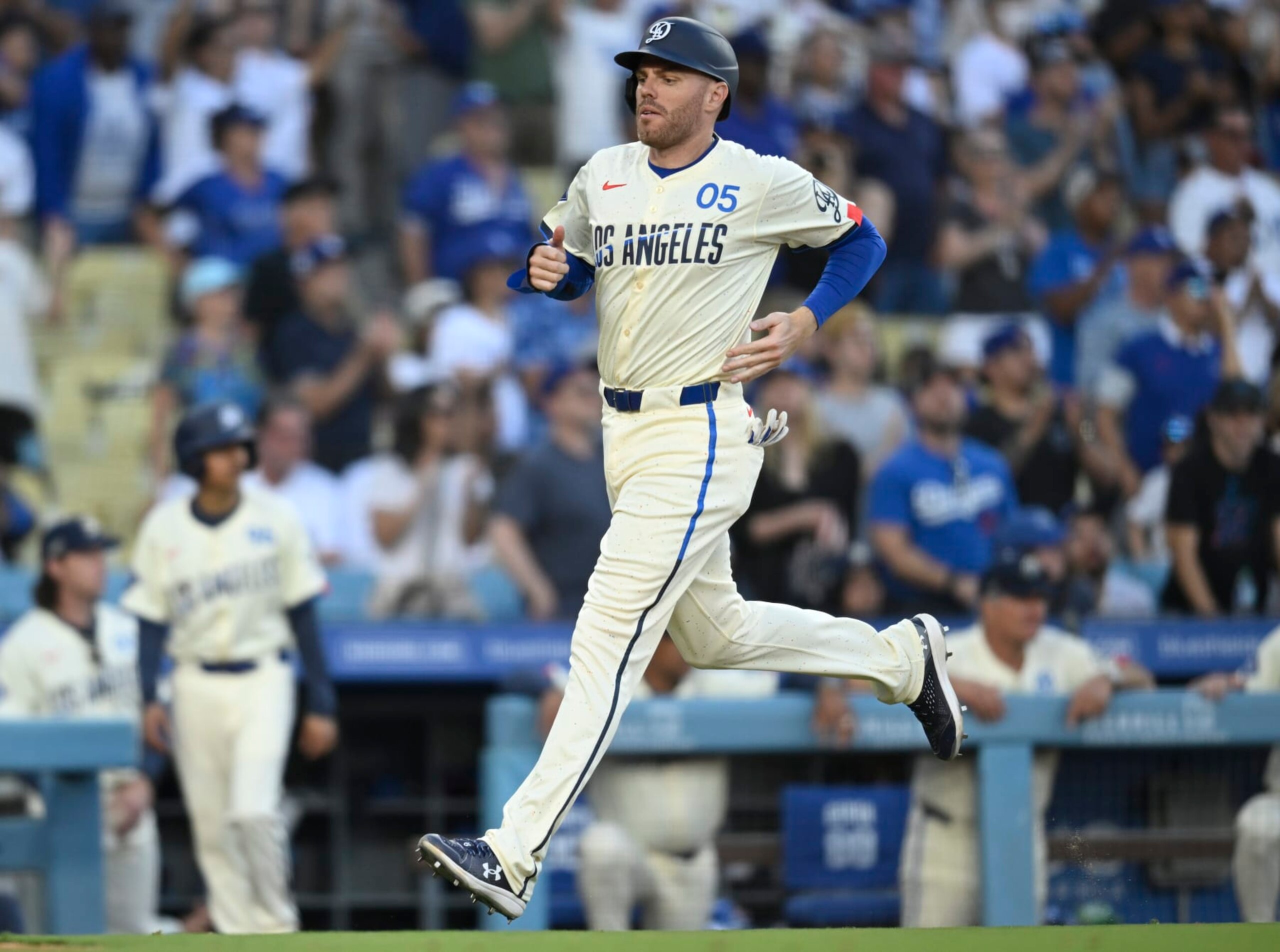 LOS ANGELES, CALIFORNIA - JULY 20: Freddie Freeman #5 of the Los Angeles Dodgers crosses the plate in the tenth inning on a double from Andy Pages while playing the Boston Red Sox at Dodger Stadium on July 20, 2024 in Los Angeles, California. (Photo by John McCoy/Getty Images)