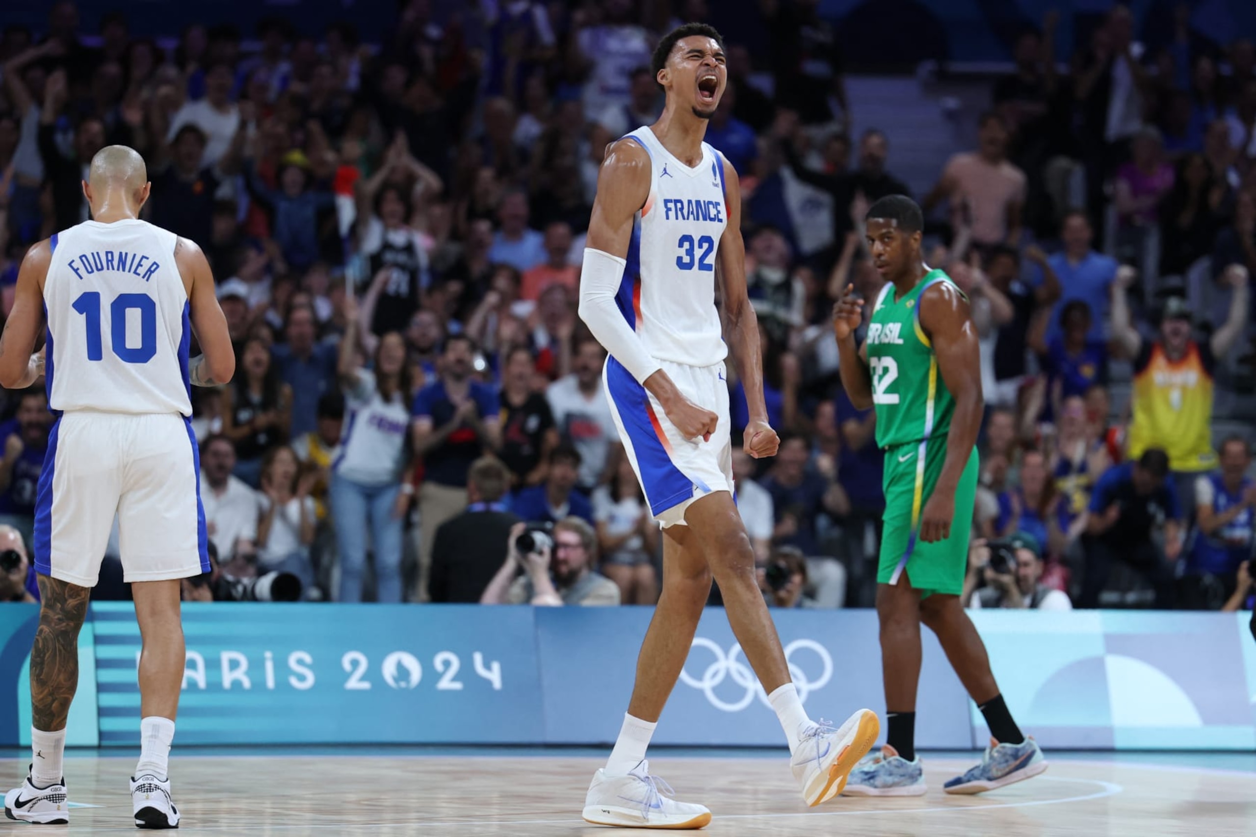 France's #32 Victor Wembanyama reacts after scoring in the men's preliminary round group B basketball match between France and Brazil during the Paris 2024 Olympic Games at the Pierre-Mauroy stadium in Villeneuve-d'Ascq, northern France, on July 27, 2024. (Photo by Thomas COEX / AFP) (Photo by THOMAS COEX/AFP via Getty Images) France's #32 Victor Wembanyama reacts after scoring in the men's preliminary round group B basketball match between France and Brazil during the Paris 2024 Olympic Games at the Pierre-Mauroy stadium in Villeneuve-d'Ascq, northern France, on July 27, 2024. (Photo by Thomas COEX / AFP) (Photo by THOMAS COEX/AFP via Getty Images)