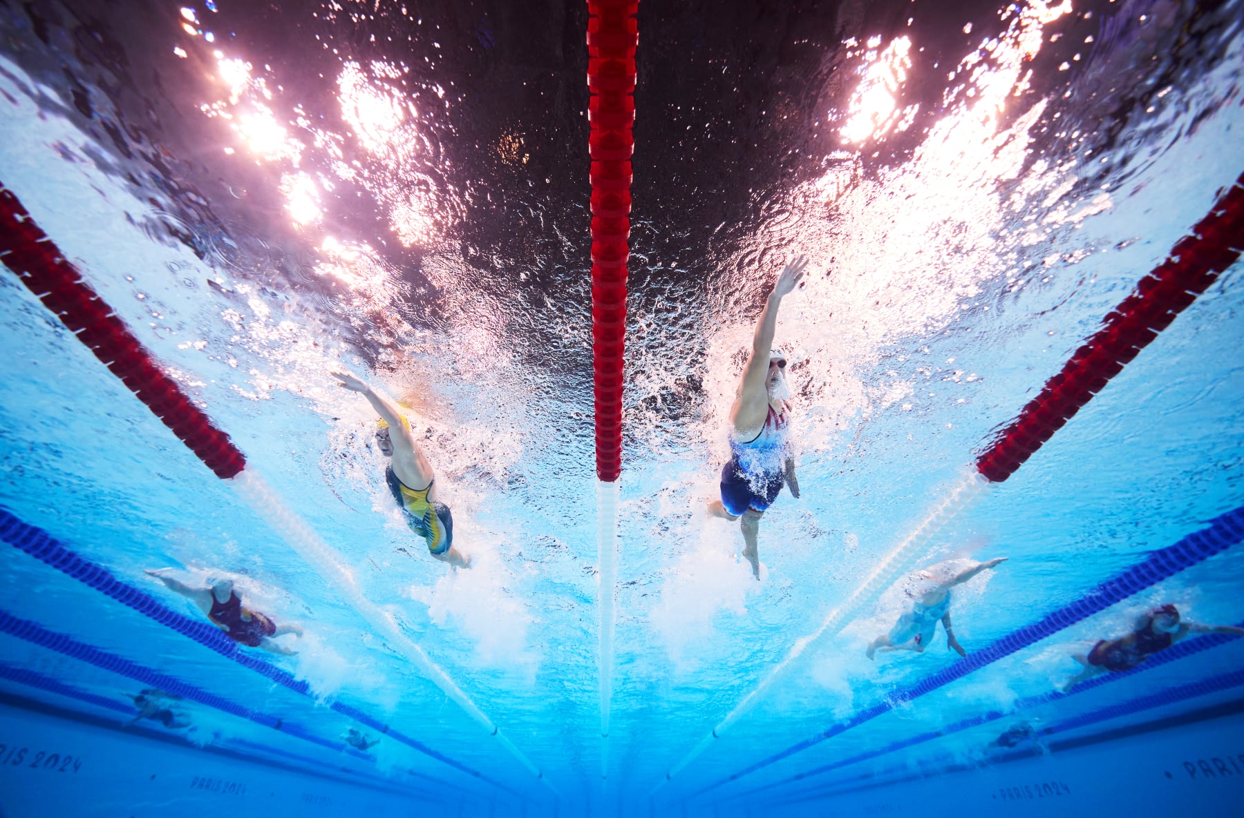 NANTERRE, FRANCE - JULY 27: (EDITORS NOTE: Image was captured using an underwater robotic camera.) Ariarne Titmus of Team Australia and Katie Ledecky of Team United States compete in the Women's 400m Freestyle Heats on day one of the Olympic Games Paris 2024 at Paris La Defense Arena on July 27, 2024 in Nanterre, France. (Photo by Adam Pretty/Getty Images)