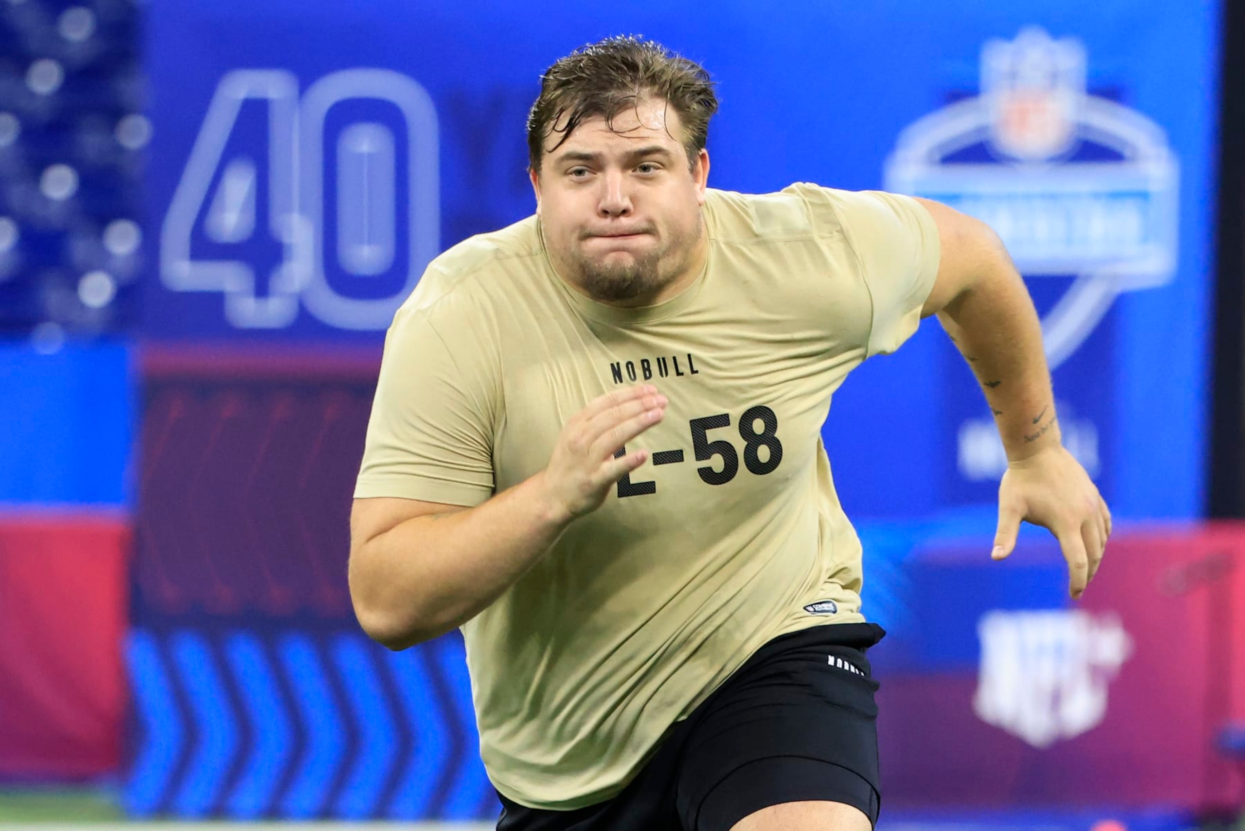 INDIANAPOLIS, INDIANA - MARCH 03: Jackson Powers-Johnson #OL58 of the Oregon participates in a drill during the NFL Combine at Lucas Oil Stadium on March 03, 2024 in Indianapolis, Indiana. (Photo by Justin Casterline/Getty Images)