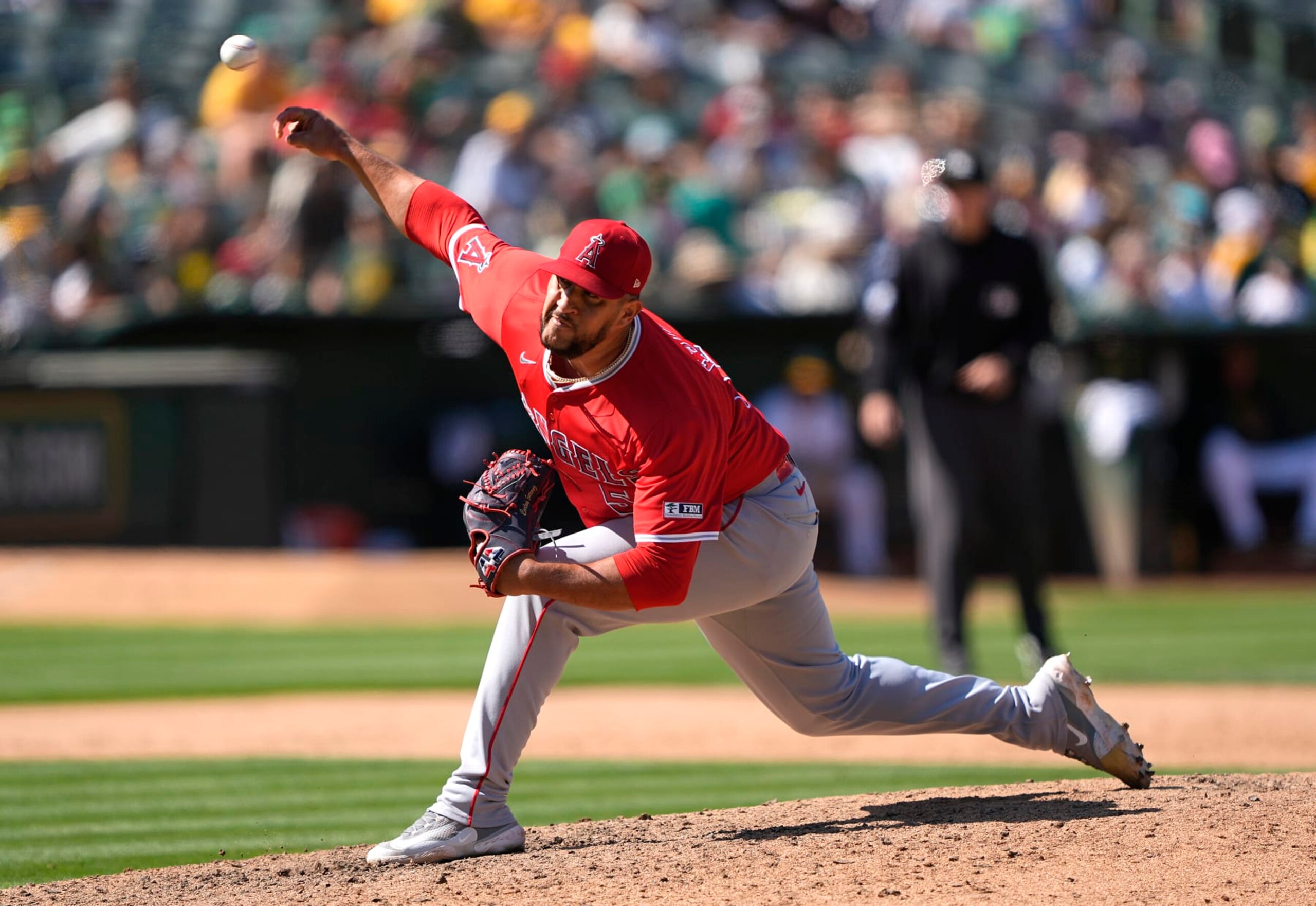 OAKLAND, CALIFORNIA - JULY 21: Carlos Estévez #53 of the Los Angeles Angels pitches against the Oakland Athletics in the bottom of the ninth inning on July 21, 2024 at the Oakland Coliseum in Oakland, California. (Photo by Thearon W. Henderson/Getty Images)