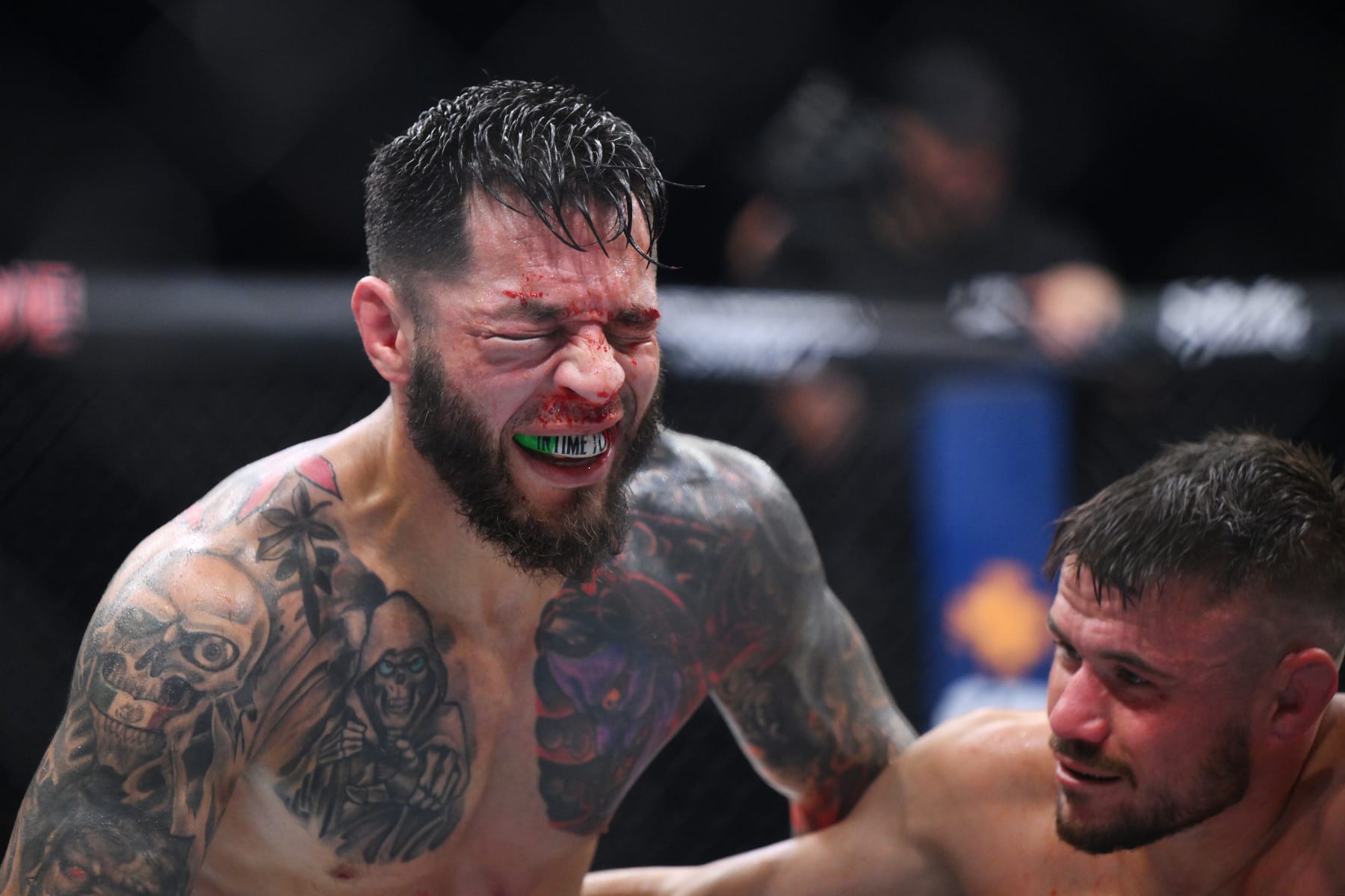 MANCHESTER, ENGLAND - JULY 27: Daniel Pineda (L) of the U.S. looks on after a defeat against Nathaniel Wood of England in a featherweight bout during the UFC 304 event at Co-op Live on July 27, 2024 in Manchester, England. (Photo by Ben Roberts Photo/Getty Images)