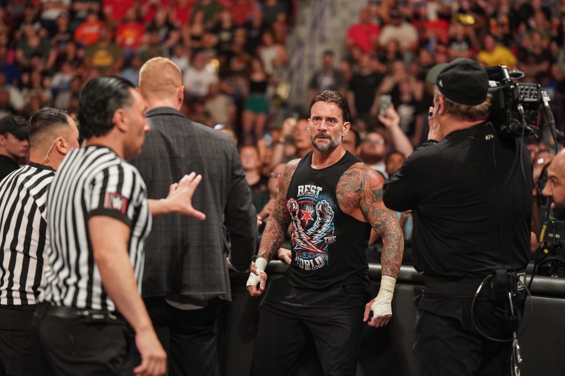 GREEN BAY, WISCONSIN - JULY 22: CM Punk looks during Monday Night RAW at Resch Center on July 22, 2024 in Green Bay, Wisconsin.  (Photo by WWE/Getty Images)