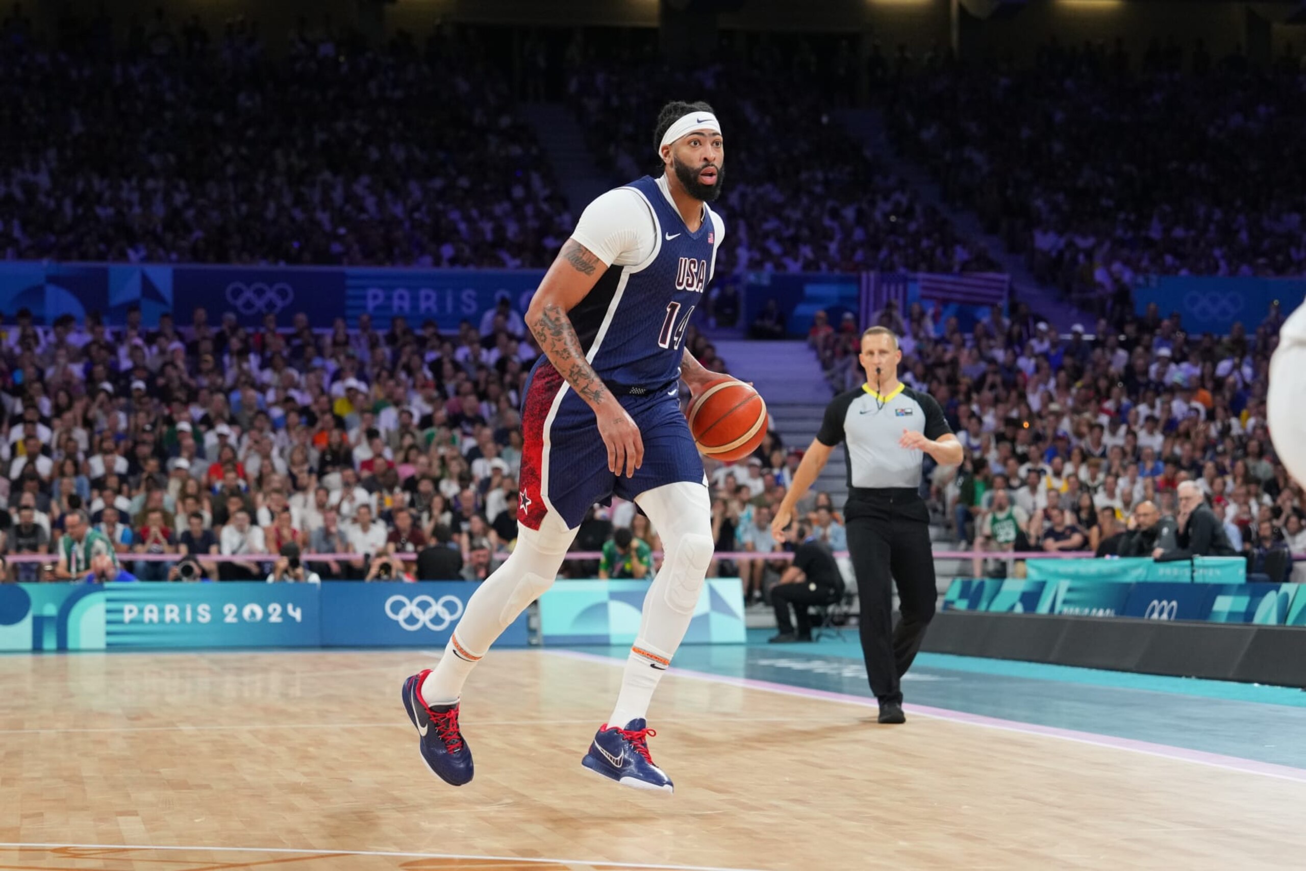 LILLE, FRANCE - JULY 28: Anthony Davis #14 of Team USA dribbles the ball during the game against the Serbian Men's National Team on July 28, 2024 at the Stade Pierre Mauroy in Paris, France. NOTE TO USER: User expressly acknowledges and agrees that, by downloading and/or using this photograph, user is consenting to the terms and conditions of the Getty Images License Agreement. Mandatory Copyright Notice: Copyright 2024 NBAE (Photo by Jesse D. Garrabrant/NBAE via Getty Images)