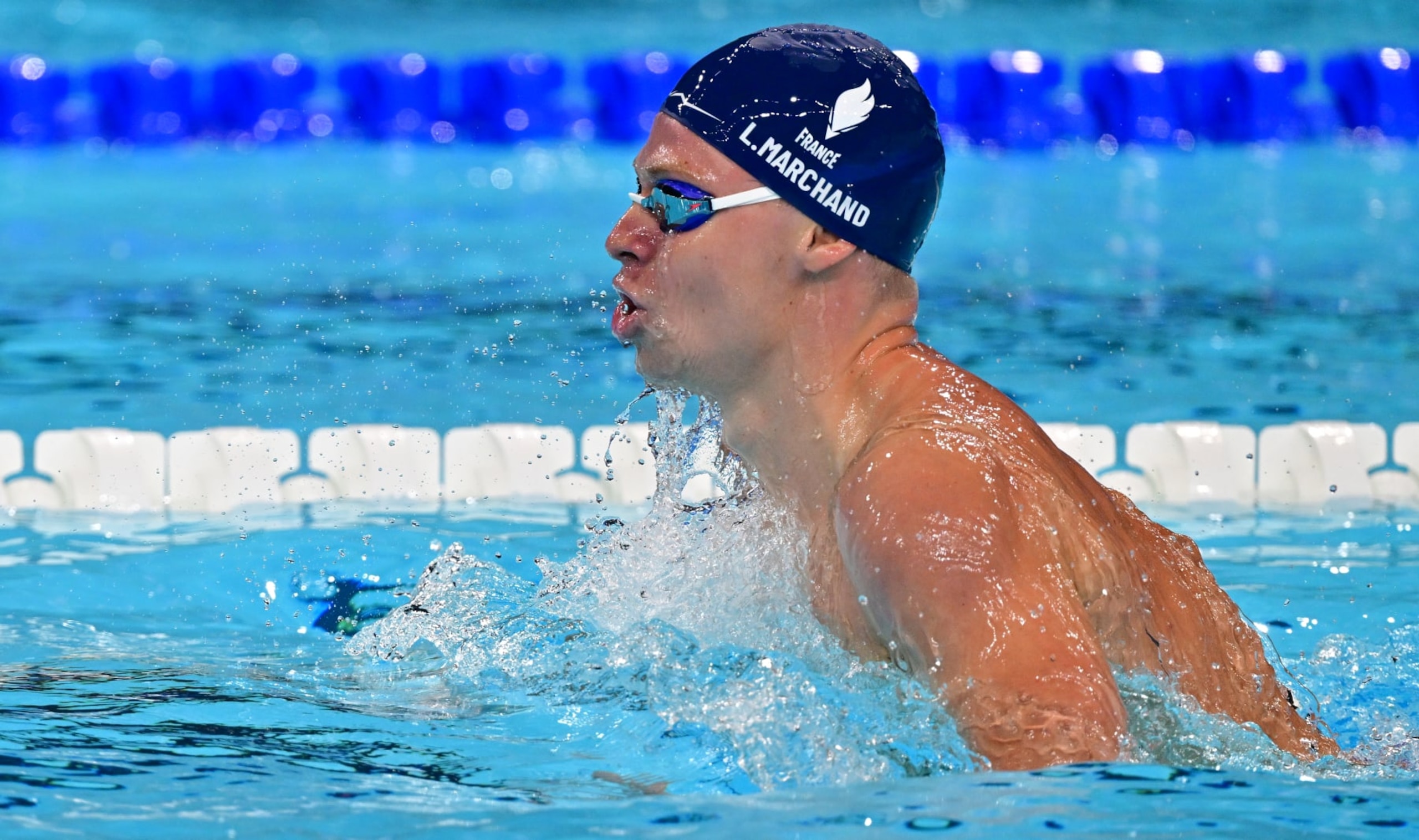 NANTERRE, FRANCE - JULY 28: Leon Marchand of Team France competes in the Men's 400m Individual Medley Heats on day two of the Olympic Games Paris 2024 at Paris La Defense Arena on July 28, 2024 in Nanterre, France.  (Photo by Christian Liewig - Corbis/Corbis via Getty Images)