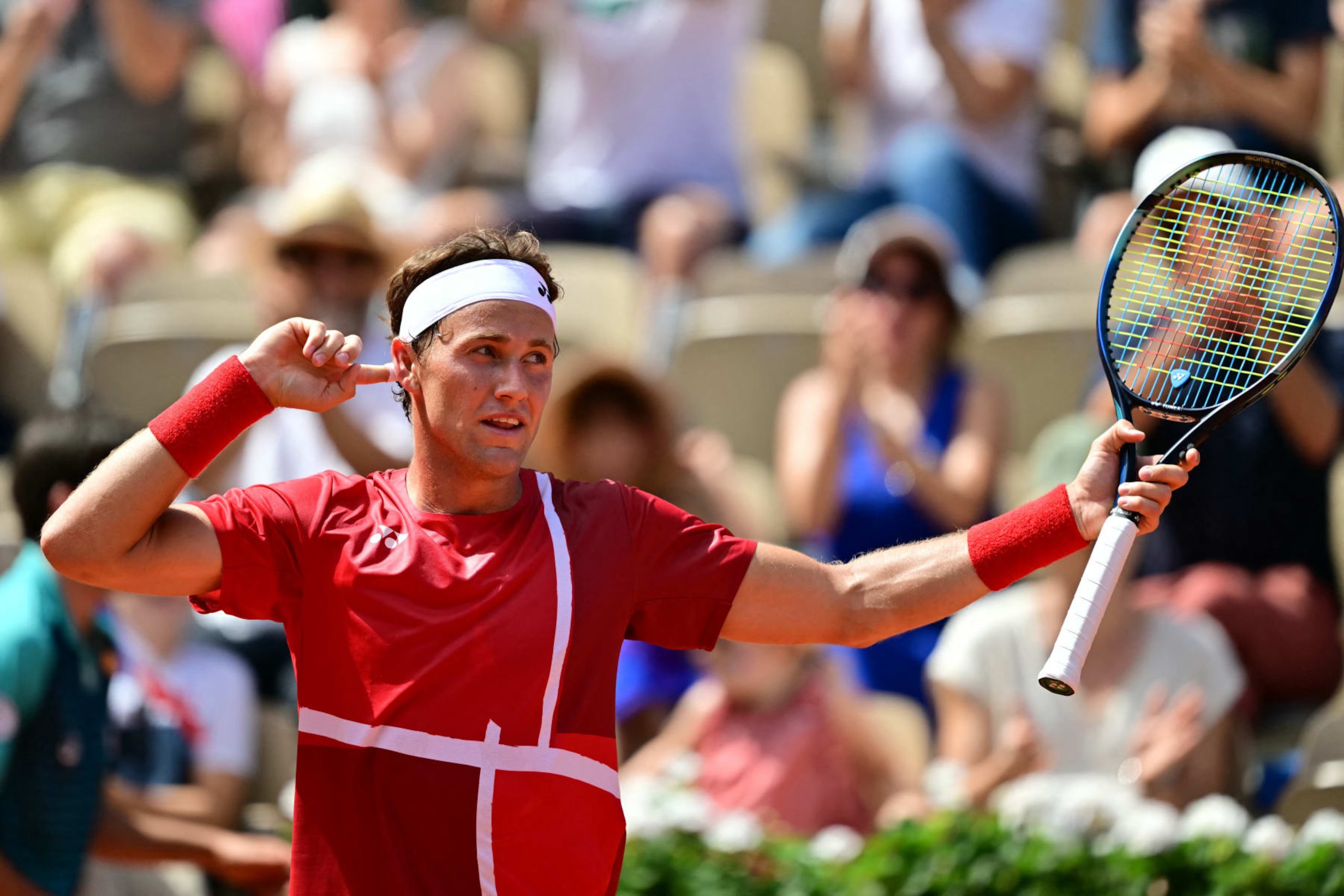 Norway's Casper Ruud reacts after beating Japan's Taro Daniel during their men's singles first round tennis match on Court Suzanne-Lenglen at the Roland-Garros Stadium at the Paris 2024 Olympic Games, in Paris on July 28, 2024. (Photo by Martin  BERNETTI / AFP) (Photo by MARTIN  BERNETTI/AFP via Getty Images)