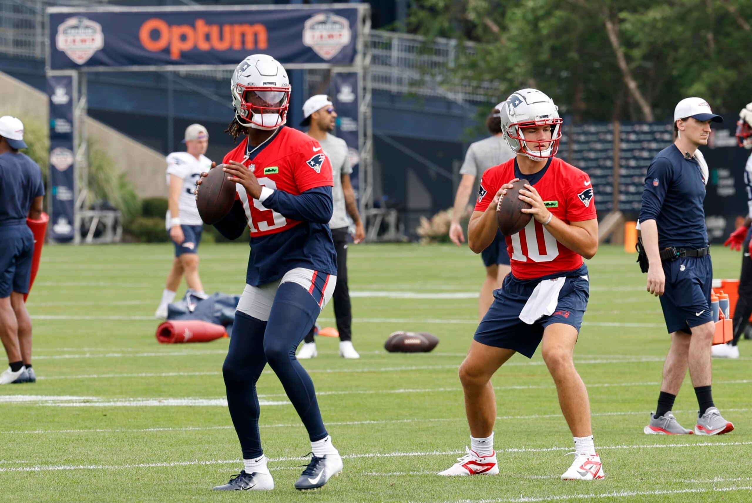 FOXBOROUGH, MA - JULY 28: New England Patriots quarterbacks Joe Milton III (19) and Drake Maye (10) run a drill during New England Patriots Training Camp on July 28, 2024, at Gillette Stadium in Foxborough, Massachusetts. (Photo by Fred Kfoury III/Icon Sportswire via Getty Images)