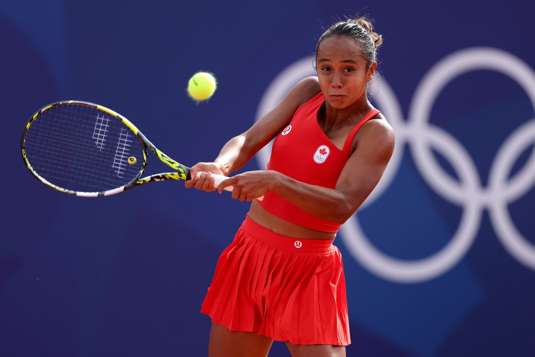 PARIS, FRANCE - JULY 28: Leylah Fernandez of Team Canada plays a backhand against Karolina Muchova of Team Czechia during the Women’s Singles first round match on day two of the Olympic Games Paris 2024 at Roland Garros on July 28, 2024 in Paris, France. (Photo by Matthew Stockman/Getty Images)