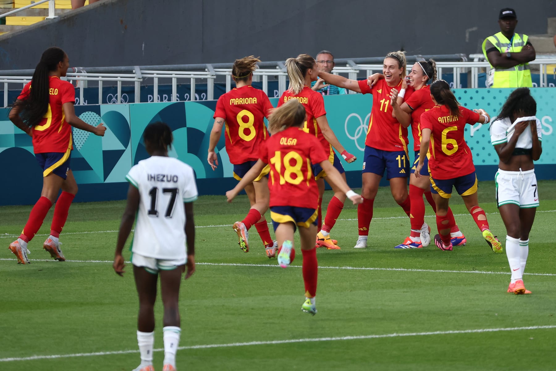 Spain's midfielder #11 Alexia Putellas celebrates with teammates after scoring her team's first goal in the women's group C football match between Spain and Nigeria during the Paris 2024 Olympic Games at the La Beaujoire Stadium in Nantes on July 28, 2024. (Photo by ROMAIN PERROCHEAU / AFP) (Photo by ROMAIN PERROCHEAU/AFP via Getty Images)