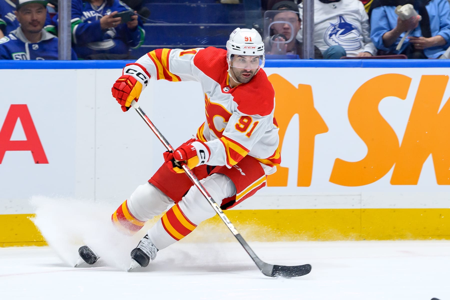 VANCOUVER, CANADA - APRIL 16: Nazem Kadri #91 of the Calgary Flames skates with the puck during the second period of their NHL game against the Vancouver Canucks at Rogers Arena on April 16, 2024 in Vancouver, British Columbia, Canada. (Photo by Derek Cain/Getty Images)