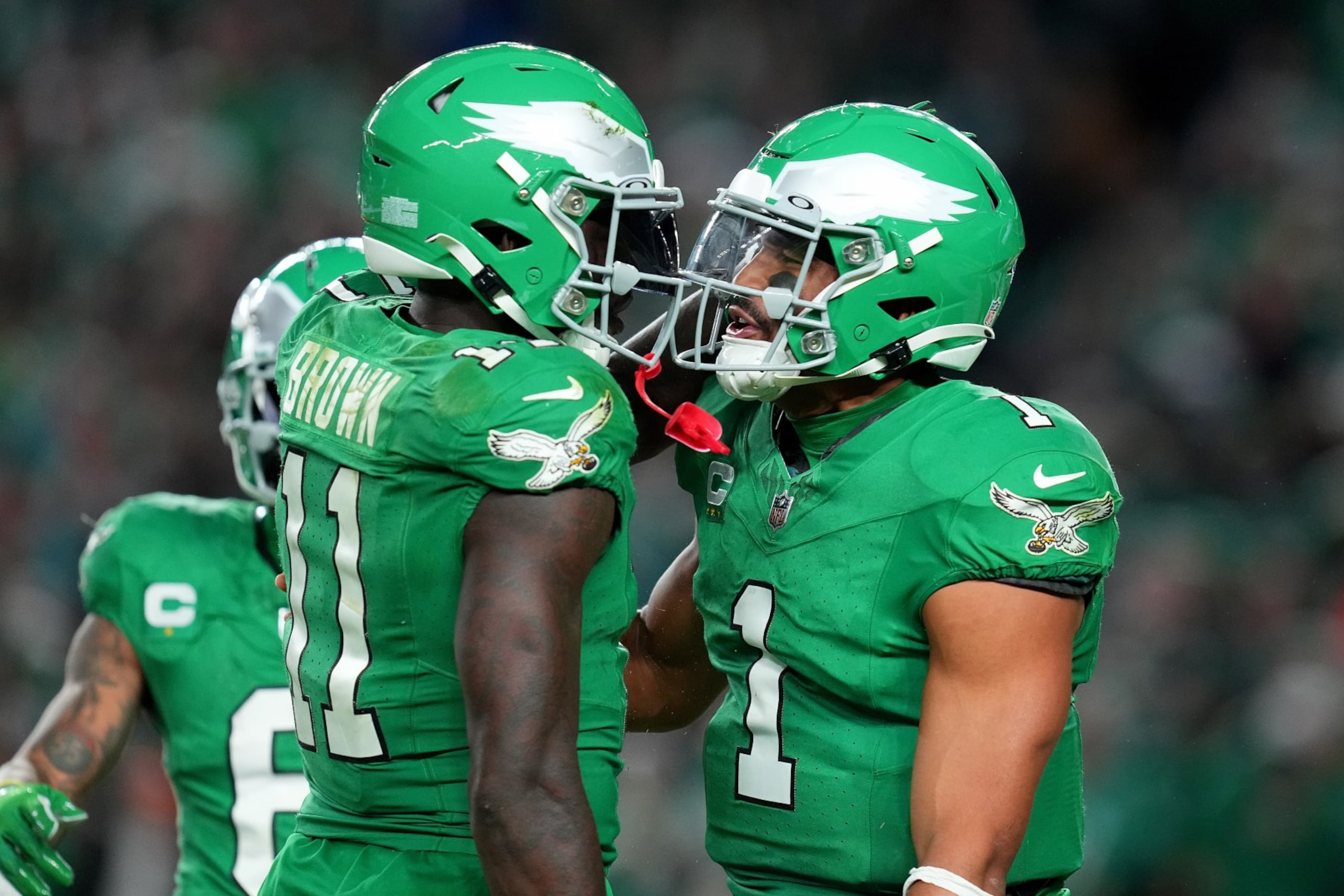 PHILADELPHIA, PENNSYLVANIA - OCTOBER 22: Jalen Hurts #1  talks with A.J. Brown #11 of the Philadelphia Eagles during the second half of a game against the Miami Dolphins at Lincoln Financial Field on October 22, 2023 in Philadelphia, Pennsylvania. (Photo by Mitchell Leff/Getty Images)
