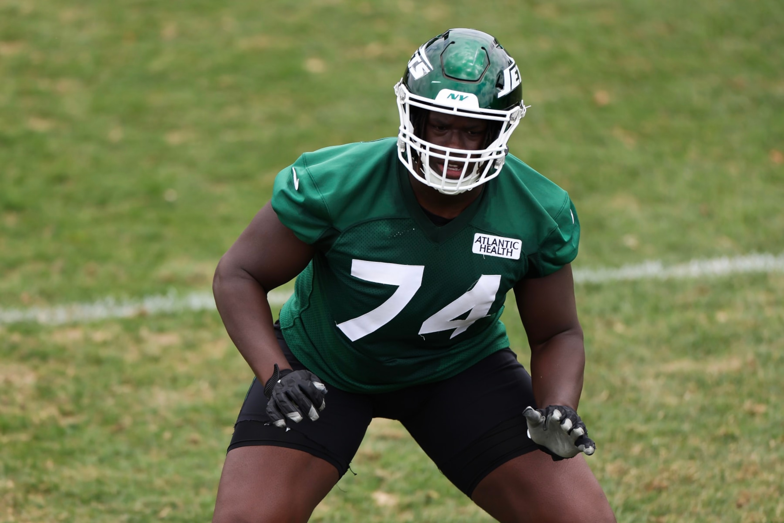 FLORHAM PARK, NEW JERSEY - JUNE 11: Olu Fashanu #74 of the New York Jets participates in drills during New York Jets Mandatory Minicamp at Atlantic Health Jets Training Center on June 11, 2024 in Florham Park, New Jersey.  (Photo by Luke Hales/Getty Images)