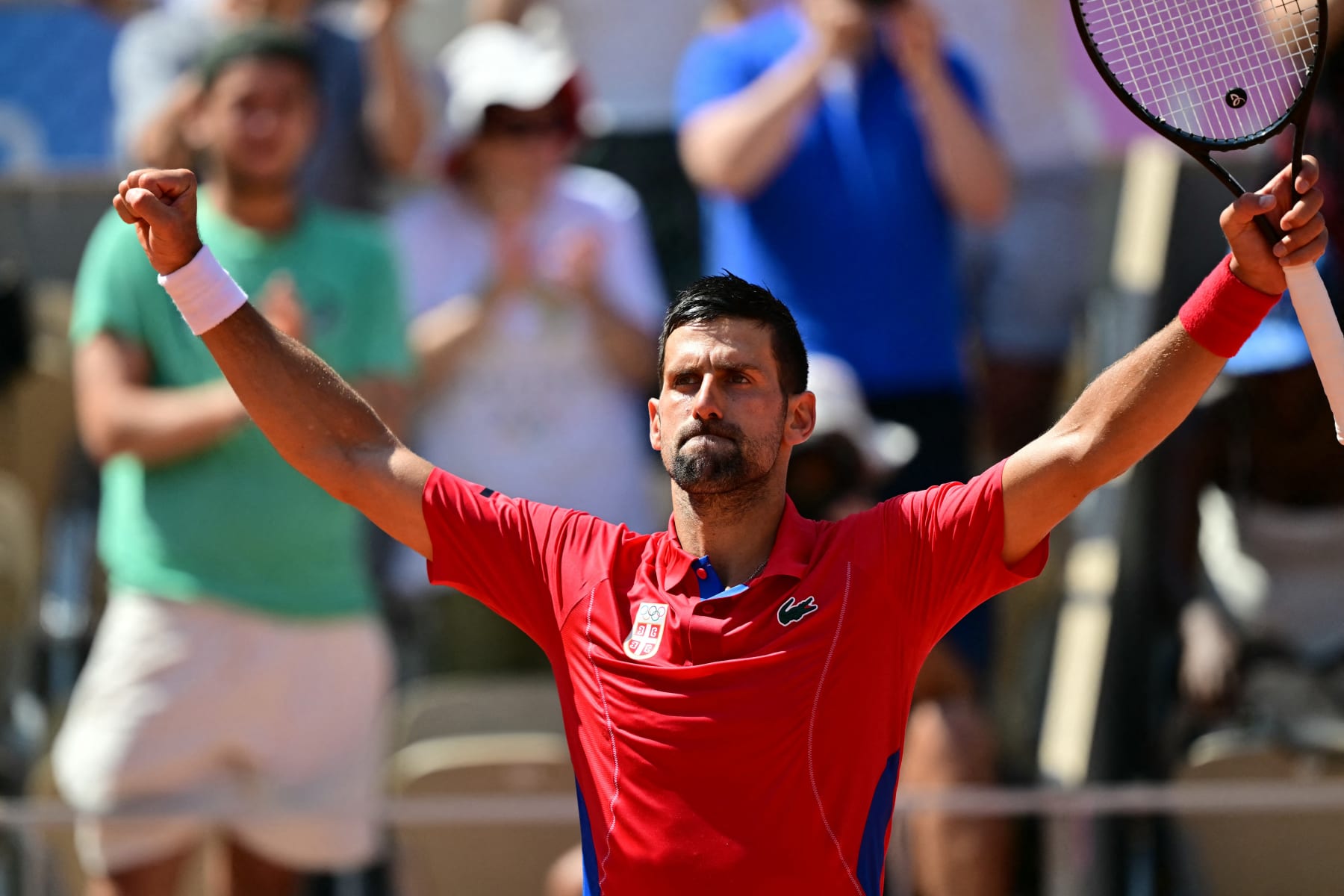 Serbia's Novak Djokovic reacts to his win over Spain's Rafael Nadal in their men's singles second round tennis match on Court Philippe-Chatrier at the Roland-Garros Stadium at the Paris 2024 Olympic Games, in Paris on July 29, 2024. (Photo by Martin  BERNETTI / AFP) (Photo by MARTIN  BERNETTI/AFP via Getty Images)