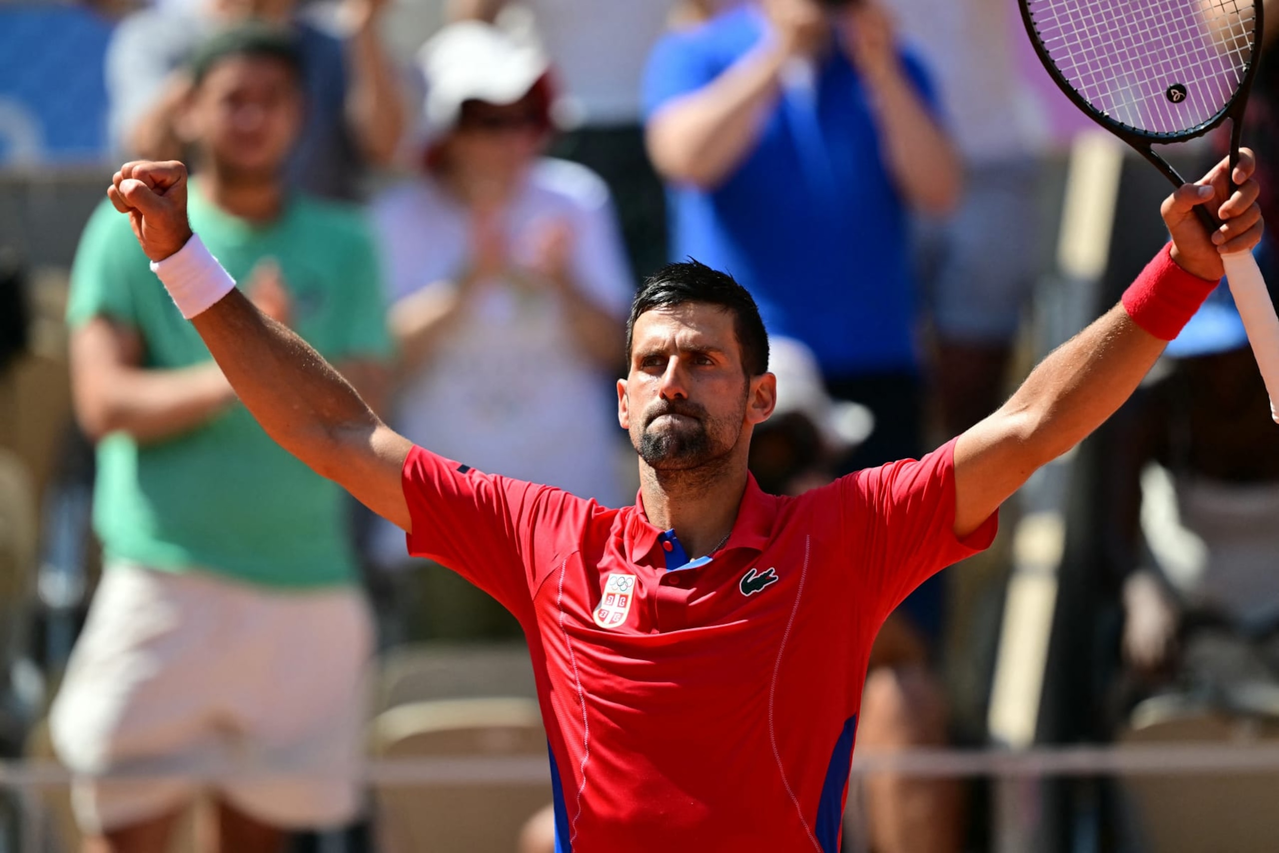 Serbia's Novak Djokovic reacts to his win over Spain's Rafael Nadal in their men's singles second round tennis match on Court Philippe-Chatrier at the Roland-Garros Stadium at the Paris 2024 Olympic Games, in Paris on July 29, 2024. (Photo by Martin  BERNETTI / AFP) (Photo by MARTIN  BERNETTI/AFP via Getty Images)