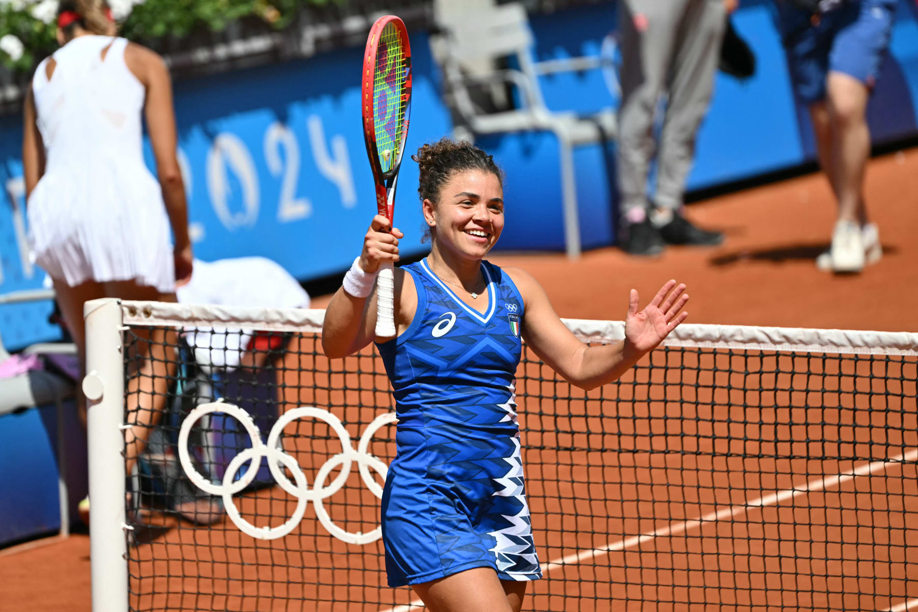 Italy's Jasmine Paolini celebrates after beating Poland's Magda Linette during their women's singles second round tennis match on Court Suzanne-Lenglen at the Roland-Garros Stadium at the Paris 2024 Olympic Games, in Paris on July 29, 2024. (Photo by Miguel MEDINA / AFP) (Photo by MIGUEL MEDINA/AFP via Getty Images)
