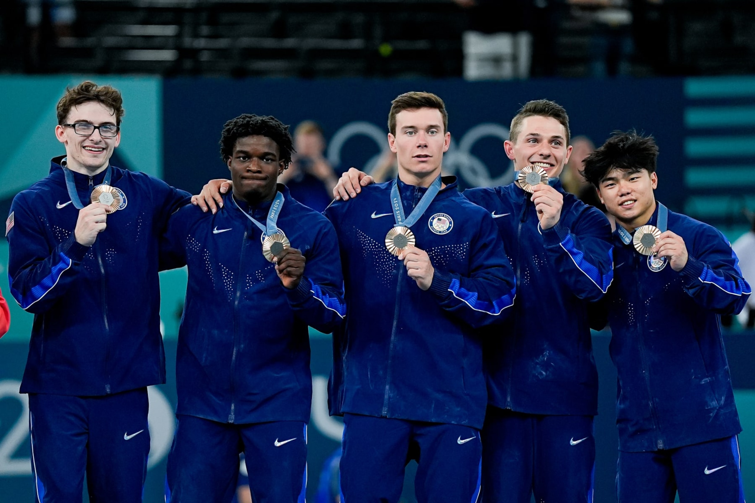 PARIS, FRANCE - JULY 29: (L-R) Stephen Nedoroscik of United States, Frederick Richard of United States, Brody Malone of United States, Paul Juda of United States, Asher Hong of United States pose for a photo with their bronze medalduring the Men's Artistic Gymnastics Team Final on day three of the Olympic Games Paris 2024 at Bercy Arena on July 29, 2024 in Paris, France. (Photo by Daniela Porcelli/Eurasia Sport Images/Getty Images)