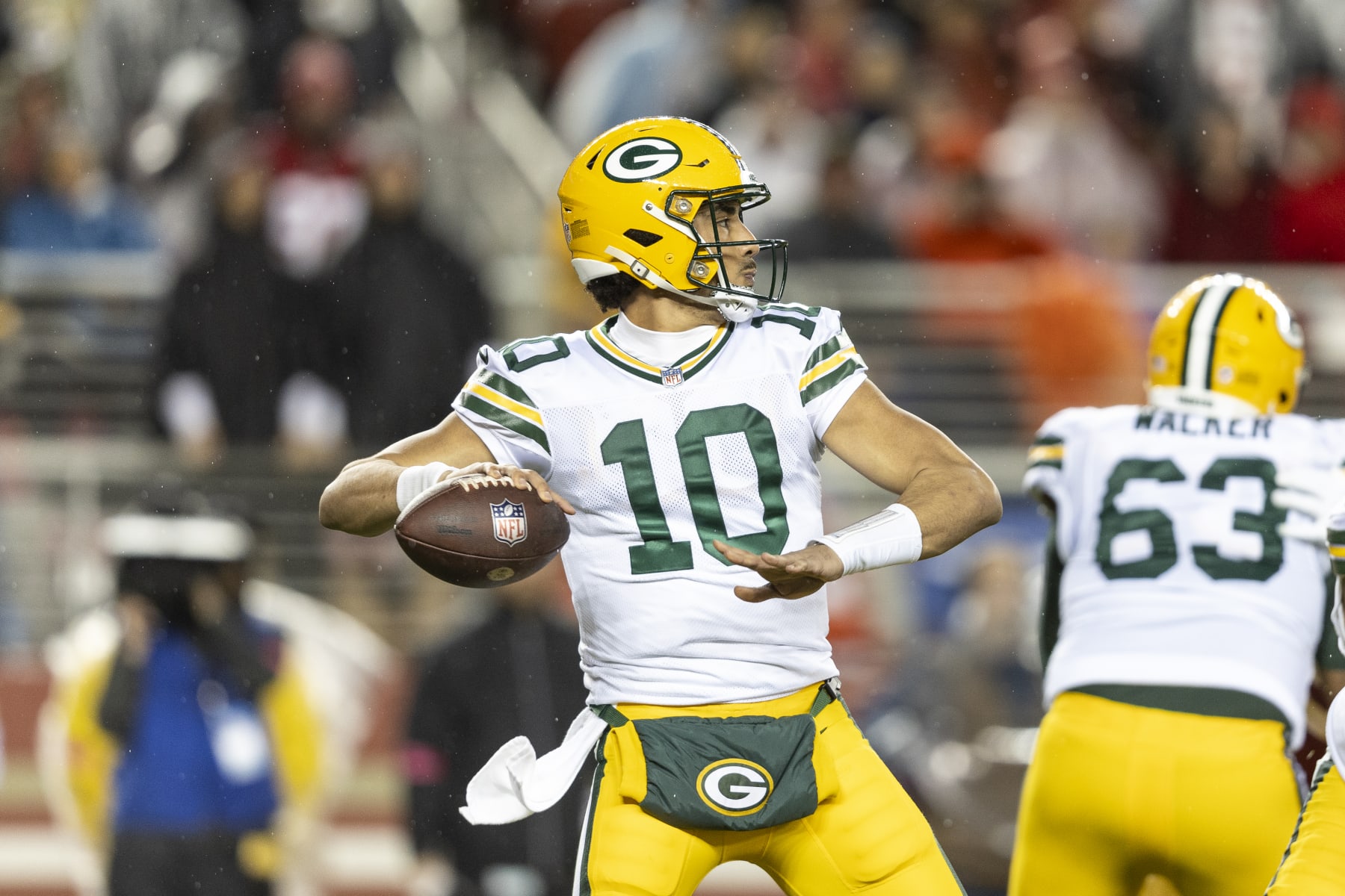 SANTA CLARA, CALIFORNIA - JANUARY 20: Jordan Love #10 of the Green Bay Packers looks to pass during an NFL divisional round playoff football game between the San Francisco 49ers and the Green Bay Packers at Levi's Stadium on January 20, 2024 in Santa Clara, California. (Photo by Michael Owens/Getty Images)