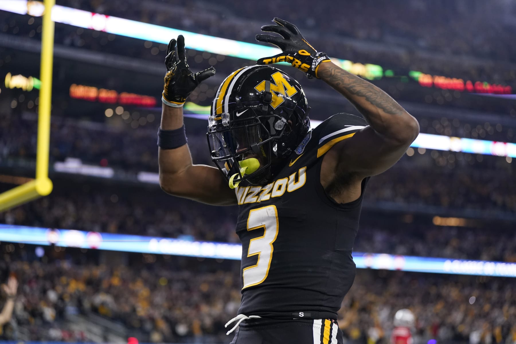 ARLINGTON, TEXAS - DECEMBER 29: Luther Burden III #3 of the Missouri Tigers celebrates after catching a pass for a touchdown during the fourth quarter against the Ohio State Buckeyes in the Goodyear Cotton Bowl at AT&T Stadium on December 29, 2023 in Arlington, Texas. (Photo by Sam Hodde/Getty Images)