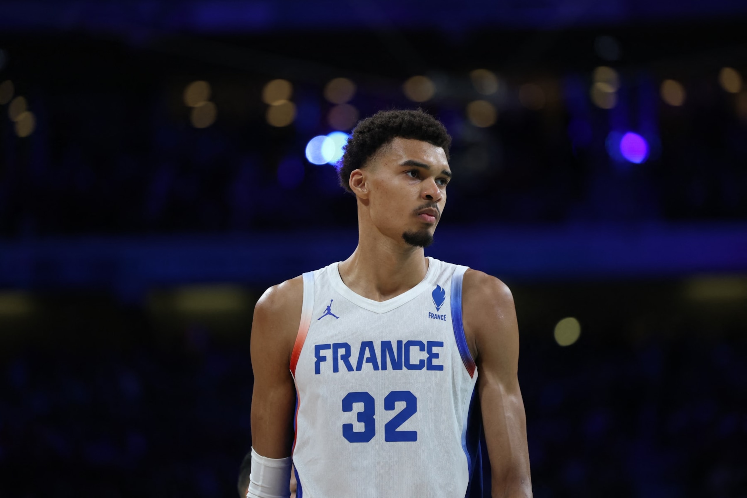 France's #32 Victor Wembanyama reacts in the men's preliminary round group B basketball match between France and Brazil during the Paris 2024 Olympic Games at the Pierre-Mauroy stadium in Villeneuve-d'Ascq, northern France, on July 27, 2024. (Photo by Thomas COEX / AFP) (Photo by THOMAS COEX/AFP via Getty Images)