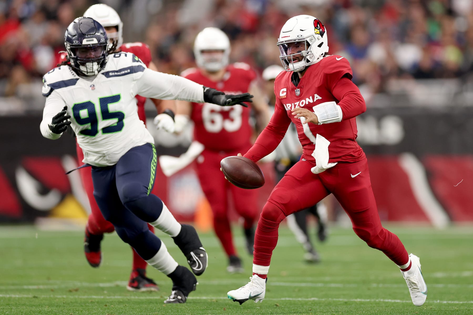GLENDALE, ARIZONA - JANUARY 07: Kyler Murray #1 of the Arizona Cardinals runs with the ball during the first half against the Seattle Seahawks at State Farm Stadium on January 07, 2024 in Glendale, Arizona. (Photo by Christian Petersen/Getty Images)
