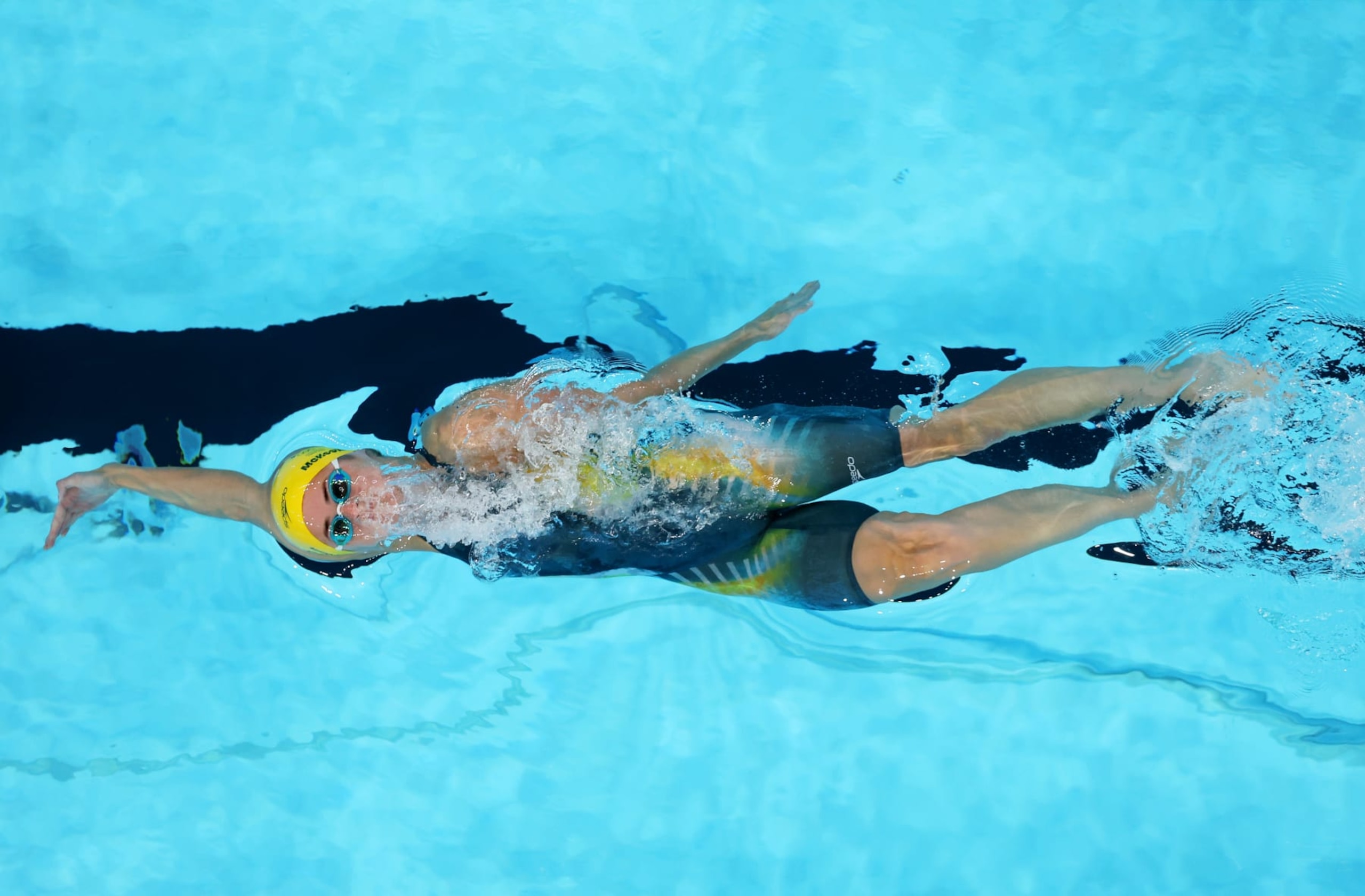 NANTERRE, FRANCE - JULY 29: (EDITORS NOTE: Image was captured using a robotic camera positioned above the field of play.) Kaylee McKeown of Team Australia competes in the Women’s 100m Backstroke Heats on day three of the Olympic Games Paris 2024 at Paris La Defense Arena on July 29, 2024 in Nanterre, France. (Photo by Richard Heathcote/Getty Images) NANTERRE, FRANCE - JULY 29: (EDITORS NOTE: Image was captured using a robotic camera positioned above the field of play.) Kaylee McKeown of Team Australia competes in the Women’s 100m Backstroke Heats on day three of the Olympic Games Paris 2024 at Paris La Defense Arena on July 29, 2024 in Nanterre, France. (Photo by Richard Heathcote/Getty Images)