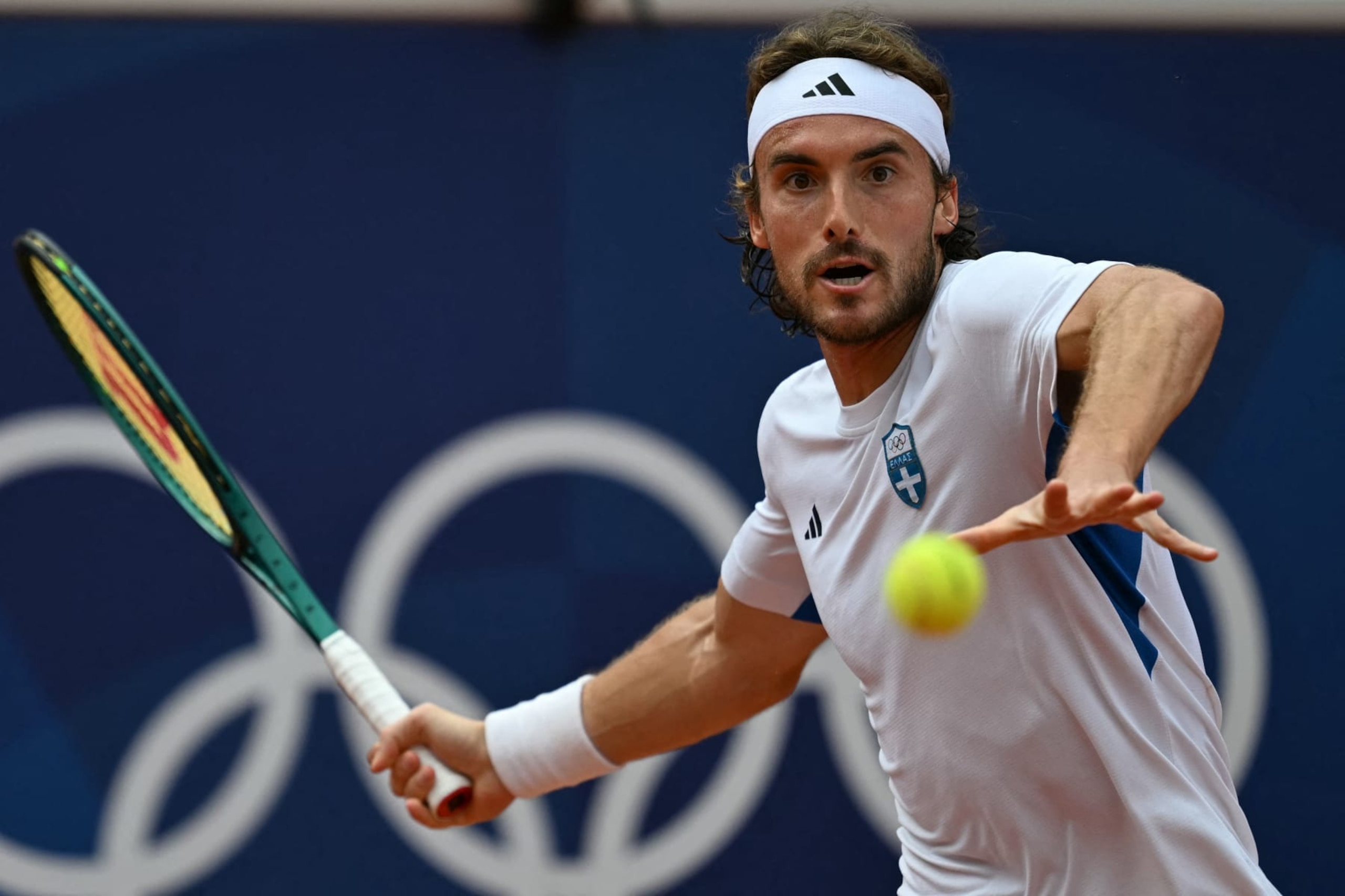 Greece's Stefanos Tsitsipas returns to Argentina's Sebastian Baez during their men's singles third round tennis match on Court Simonne-Mathieu at the Roland-Garros Stadium during the Paris 2024 Olympic Games, in Paris on July 31, 2024. (Photo by MARTIN BERNETTI / AFP) (Photo by MARTIN BERNETTI/AFP via Getty Images)