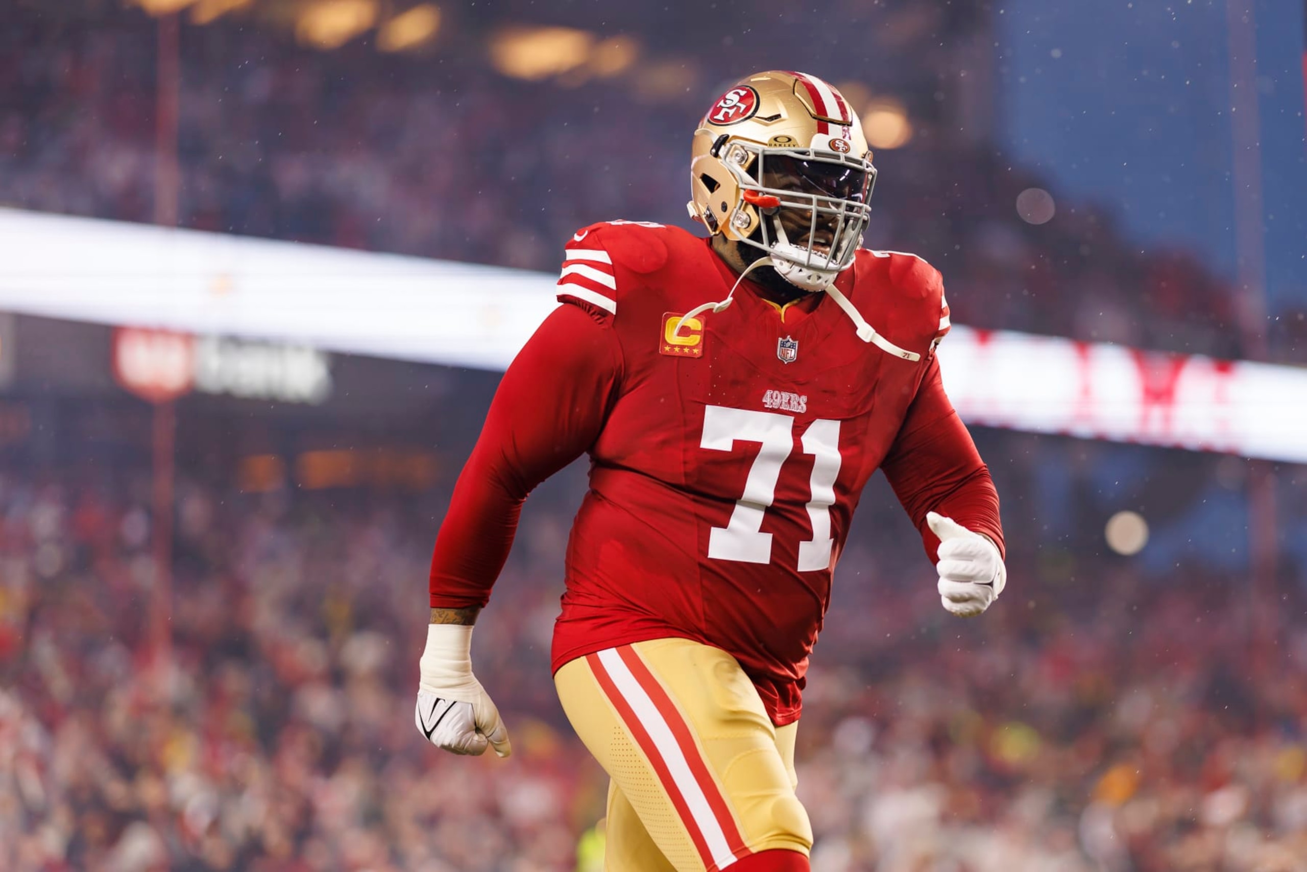 SANTA CLARA, CALIFORNIA - JANUARY 20: Trent Williams #71 of the San Francisco 49ers runs onto the field during player introductions before an NFC divisional round playoff football game against the Green Bay Packers at Levi's Stadium on January 20, 2024 in Santa Clara, California. (Photo by Ryan Kang/Getty Images)