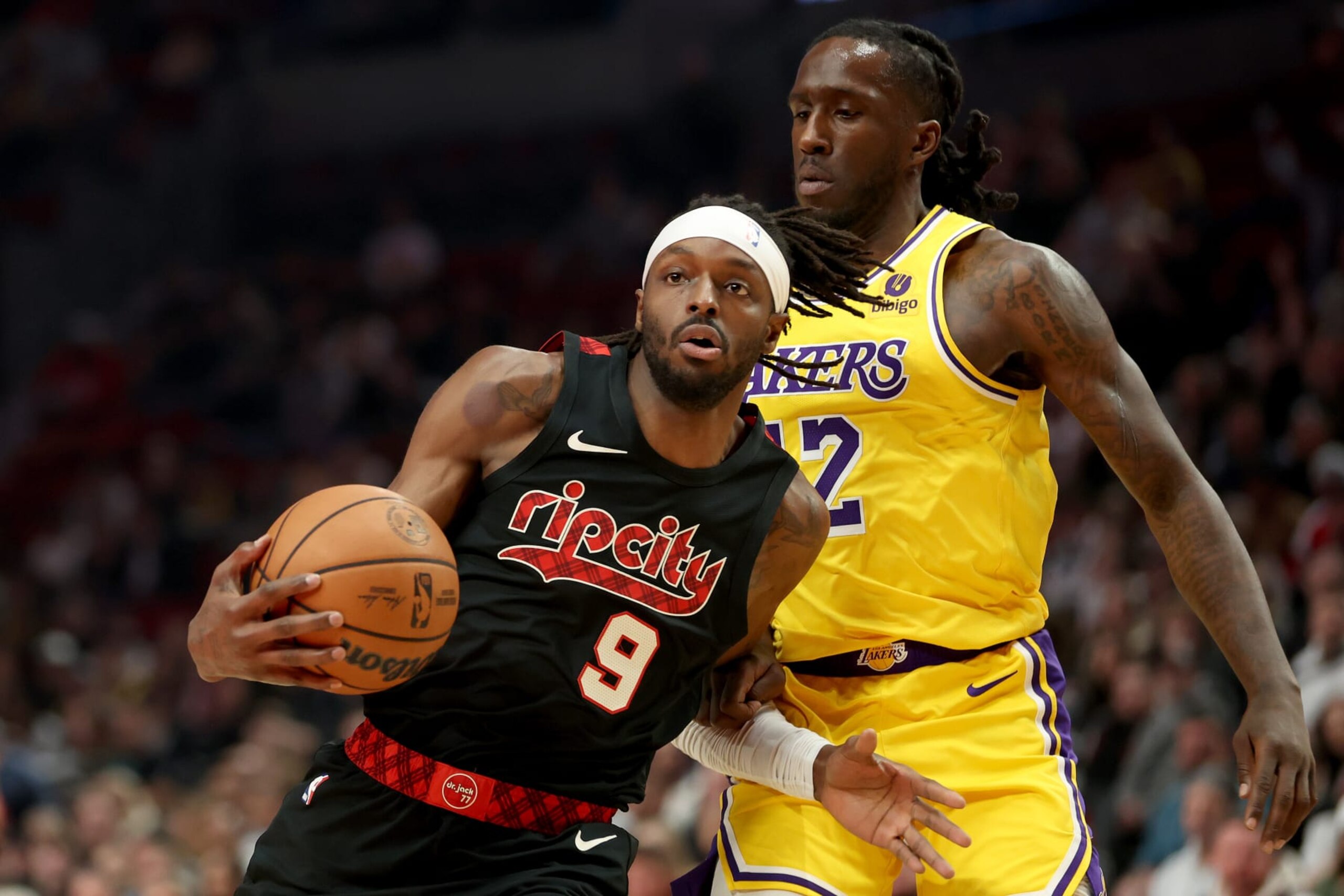 PORTLAND, OREGON - NOVEMBER 17: Jerami Grant #9 of the Portland Trail Blazers dribbles against Taurean Prince #12 of the Los Angeles Lakers at Moda Center on November 17, 2023 in Portland, Oregon. NOTE TO USER: User expressly acknowledges and agrees that, by downloading and or using this photograph, User is consenting to the terms and conditions of the Getty Images License Agreement. (Photo by Steph Chambers/Getty Images)