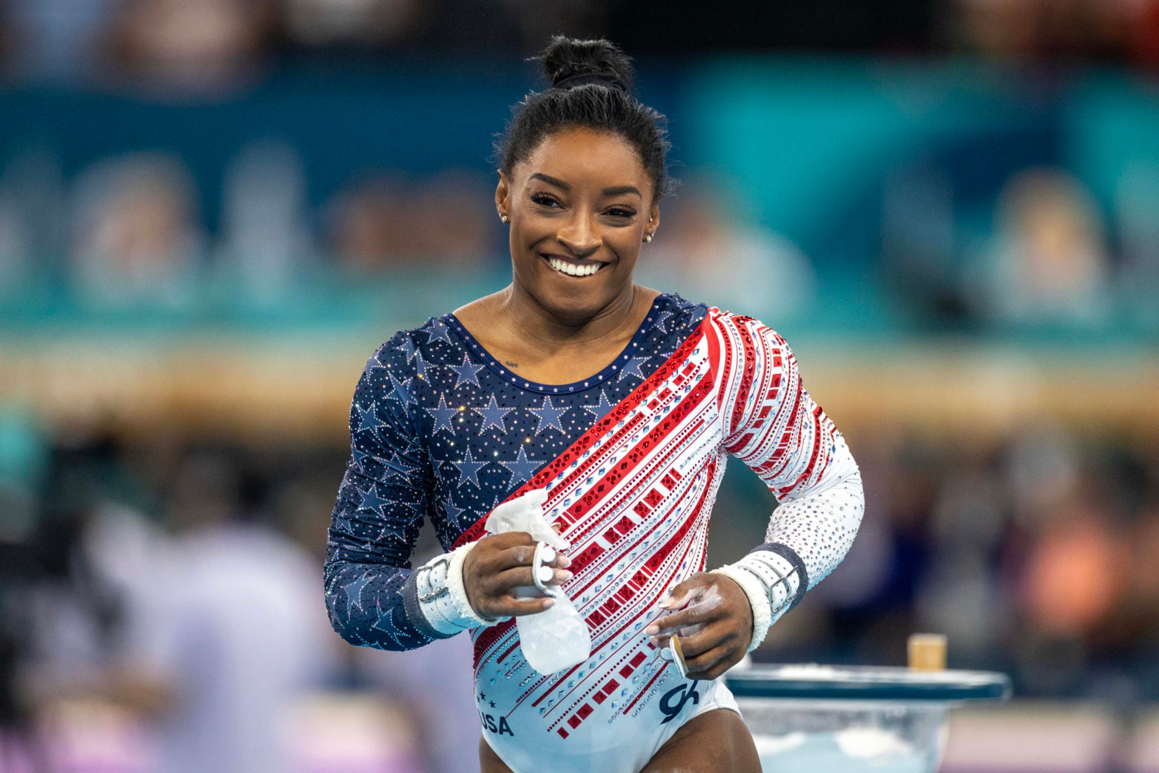 PARIS, FRANCE: JULY 30: Simone Biles of the United States reacts after performing her uneven bars routine during the Artistic Gymnastics Team Final for Women at the Bercy Arena during the Paris 2024 Summer Olympic Games on July 30th, 2024 in Paris, France. (Photo by Tim Clayton/Corbis via Getty Images)