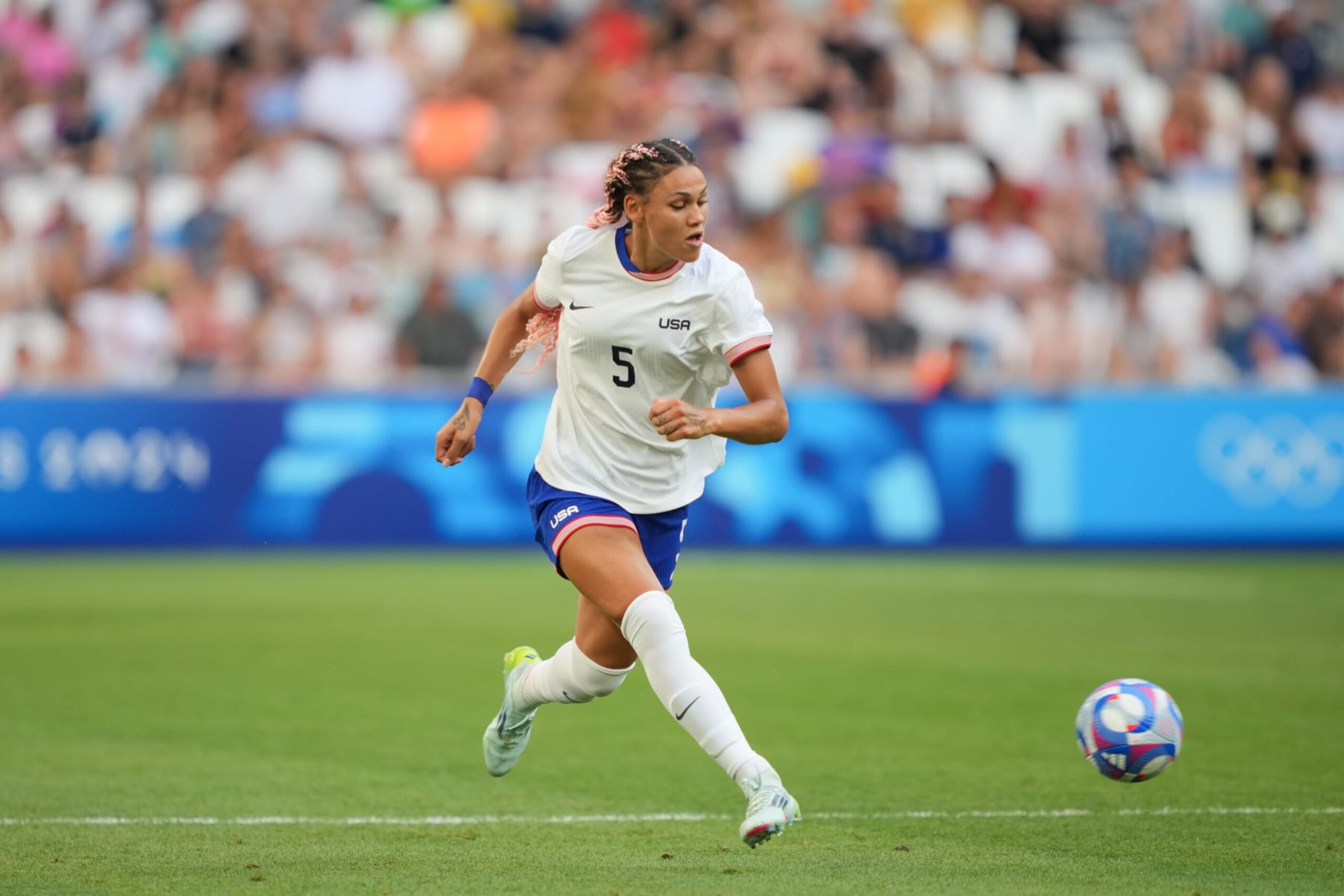 MARSEILLE, FRANCE - JULY 31: Trinity Rodman #5 of the United States  passes the ball during the first half against Australia during the Women's group B match during the Olympic Games Paris 2024 at Stade de Marseille on July 31, 2024 in Marseille, France. (Photo by John Todd/ISI/Getty Images)