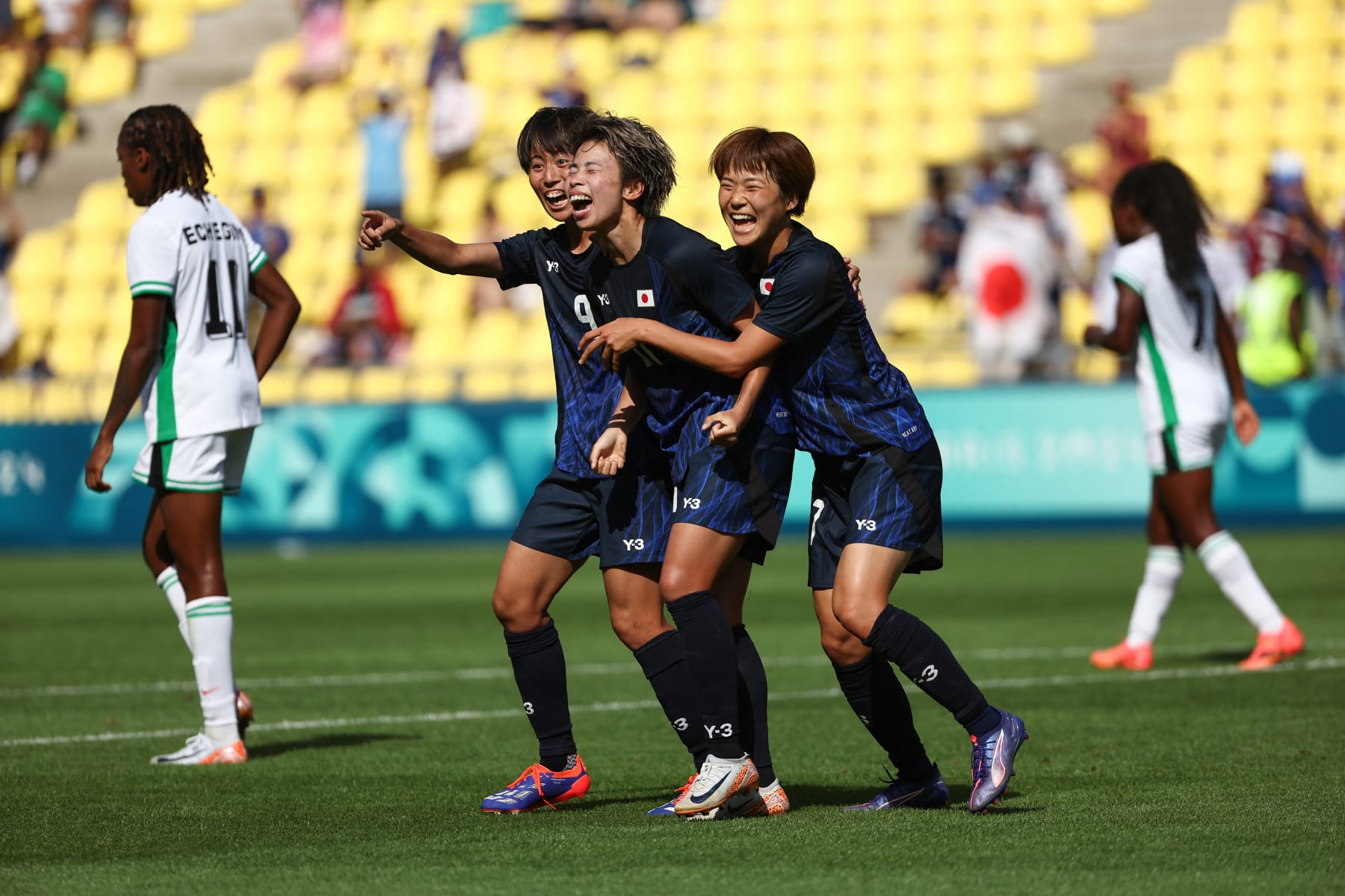 Japan's forward #11 Mina Tanaka (C) celebrates with Japan's forward #09 Riko Ueki (2ndL) and Japan's forward #17 Maika Hamano after scoring her team's second goal during the women's group C football match between Japan and Nigeria of the Paris 2024 Olympic Games at La Beaujoire Stadium in Nantes on July 31, 2024. (Photo by ROMAIN PERROCHEAU / AFP) (Photo by ROMAIN PERROCHEAU/AFP via Getty Images)