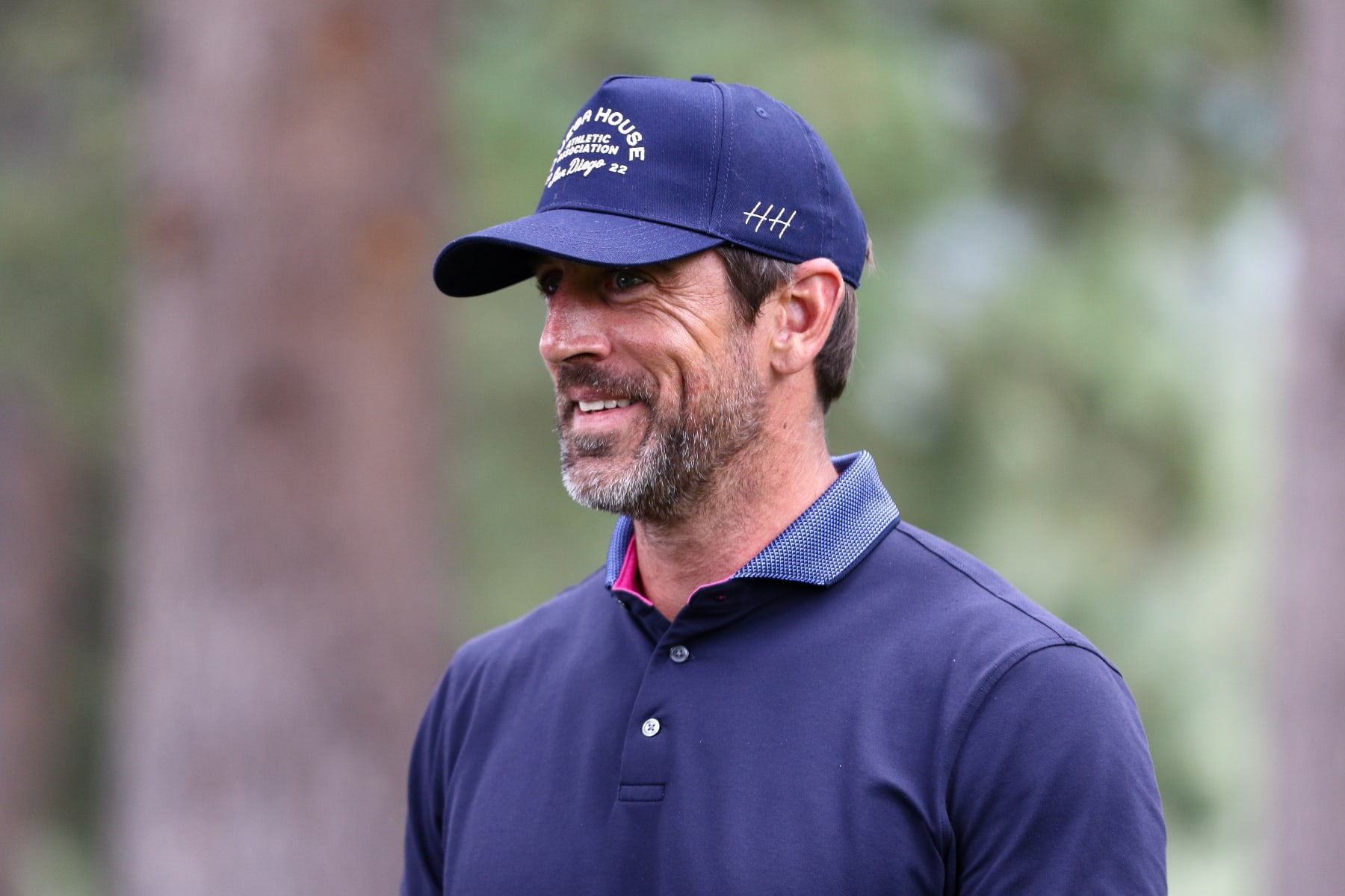 STATELINE, NEVADA - JULY 14: NFL football player Aaron Rodgers smiles at the 13th hole on day three of the 2024 American Century Championship at Edgewood Tahoe Golf Course on July 14, 2024 in Stateline, Nevada. (Photo by Isaiah Vazquez/Getty Images)