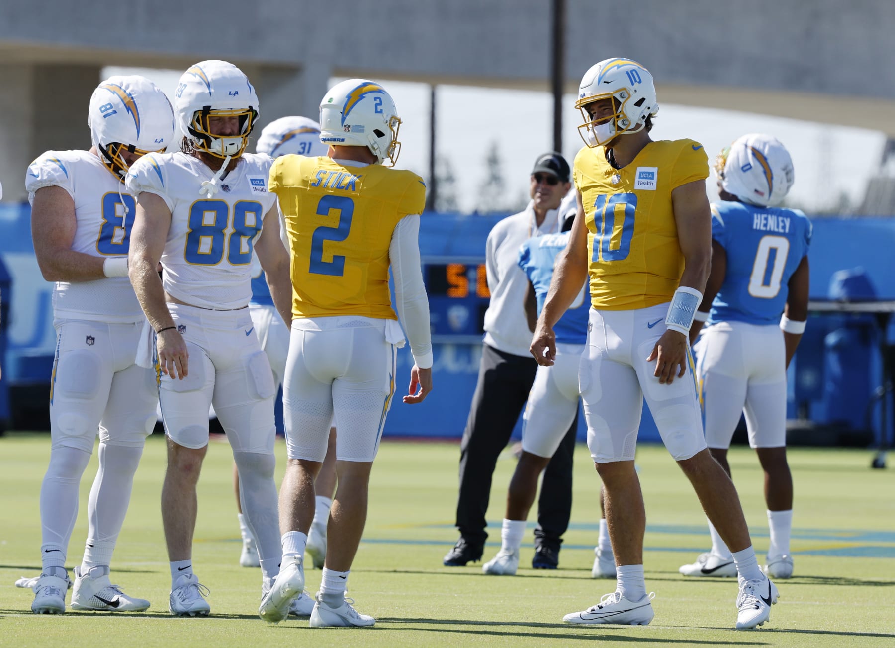 EL SEGUNDO, CALIFORNIA - JULY 29: Quarterbacks Easton Stick #2 and Justin Herbert #10 during a training session at The Bolt on July 29, 2024 in El Segundo, California. (Photo by Kevork Djansezian/Getty Images)