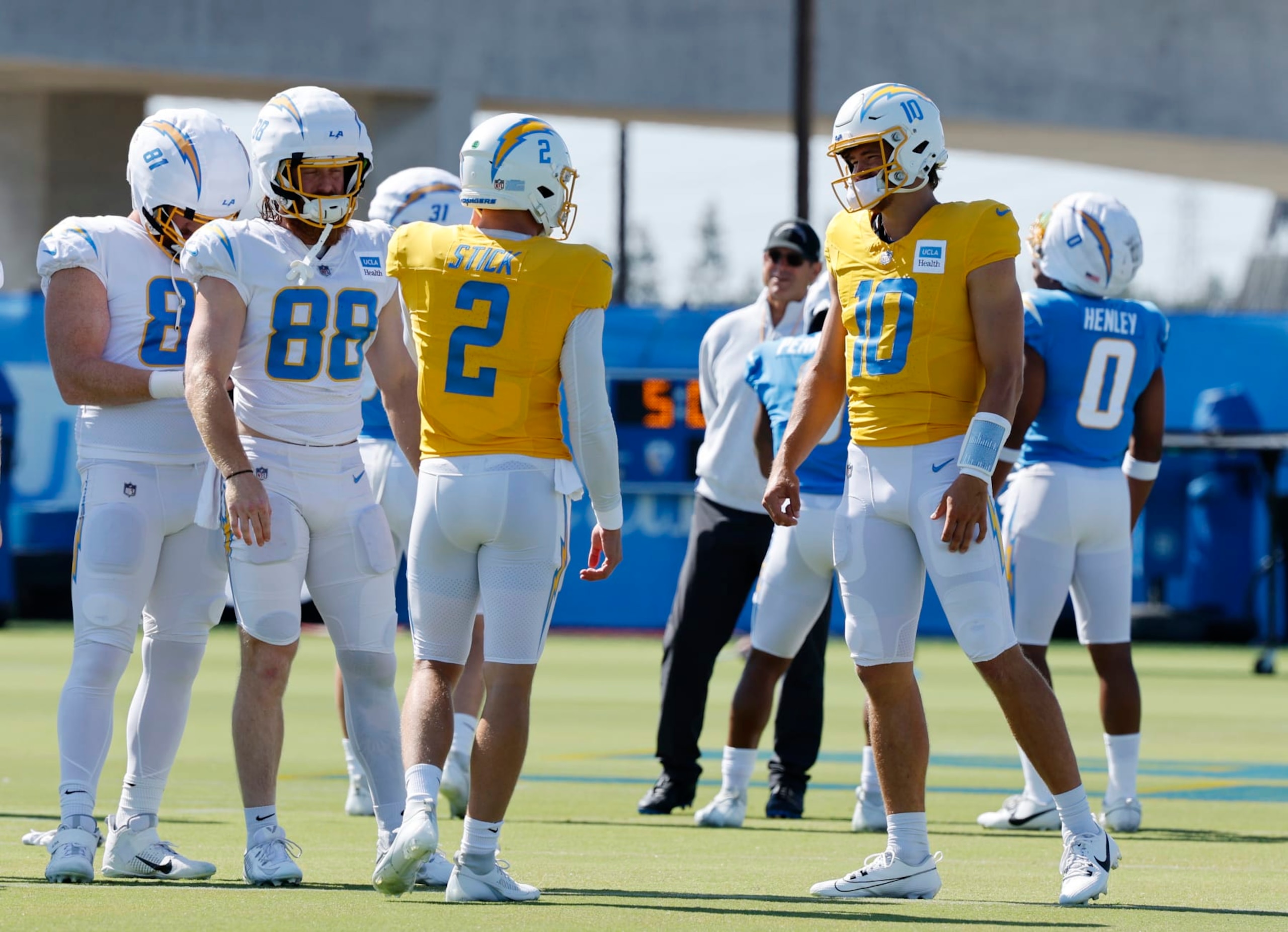 EL SEGUNDO, CALIFORNIA - JULY 29: Quarterbacks Easton Stick #2 and Justin Herbert #10 during a training session at The Bolt on July 29, 2024 in El Segundo, California. (Photo by Kevork Djansezian/Getty Images)