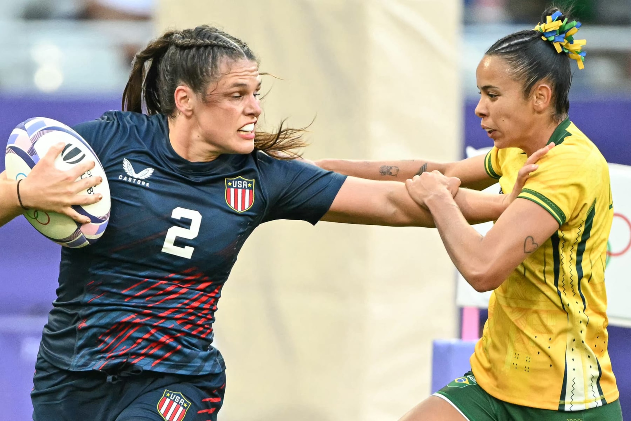 US' Ilona Maher (L) is chased by Brazil's Gabriela Lima (R) during the women's pool C rugby sevens match between the USA and Brazil during the Paris 2024 Olympic Games at the Stade de France in Saint-Denis on July 28, 2024. (Photo by CARL DE SOUZA / AFP) (Photo by CARL DE SOUZA/AFP via Getty Images) US' Ilona Maher (L) is chased by Brazil's Gabriela Lima (R) during the women's pool C rugby sevens match between the USA and Brazil during the Paris 2024 Olympic Games at the Stade de France in Saint-Denis on July 28, 2024. (Photo by CARL DE SOUZA / AFP) (Photo by CARL DE SOUZA/AFP via Getty Images)