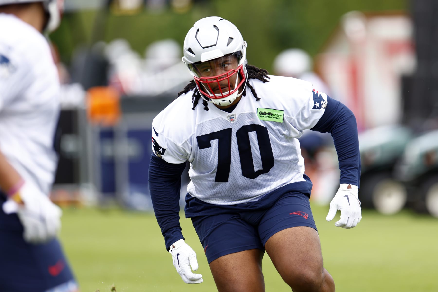 Foxborough, MA - May 29: New England Patriots rookie tackle Caedan Wallace runs drills during OTAs at the Gillette Stadium practice field. (Photo by Danielle Parhizkaran/The Boston Globe via Getty Images)