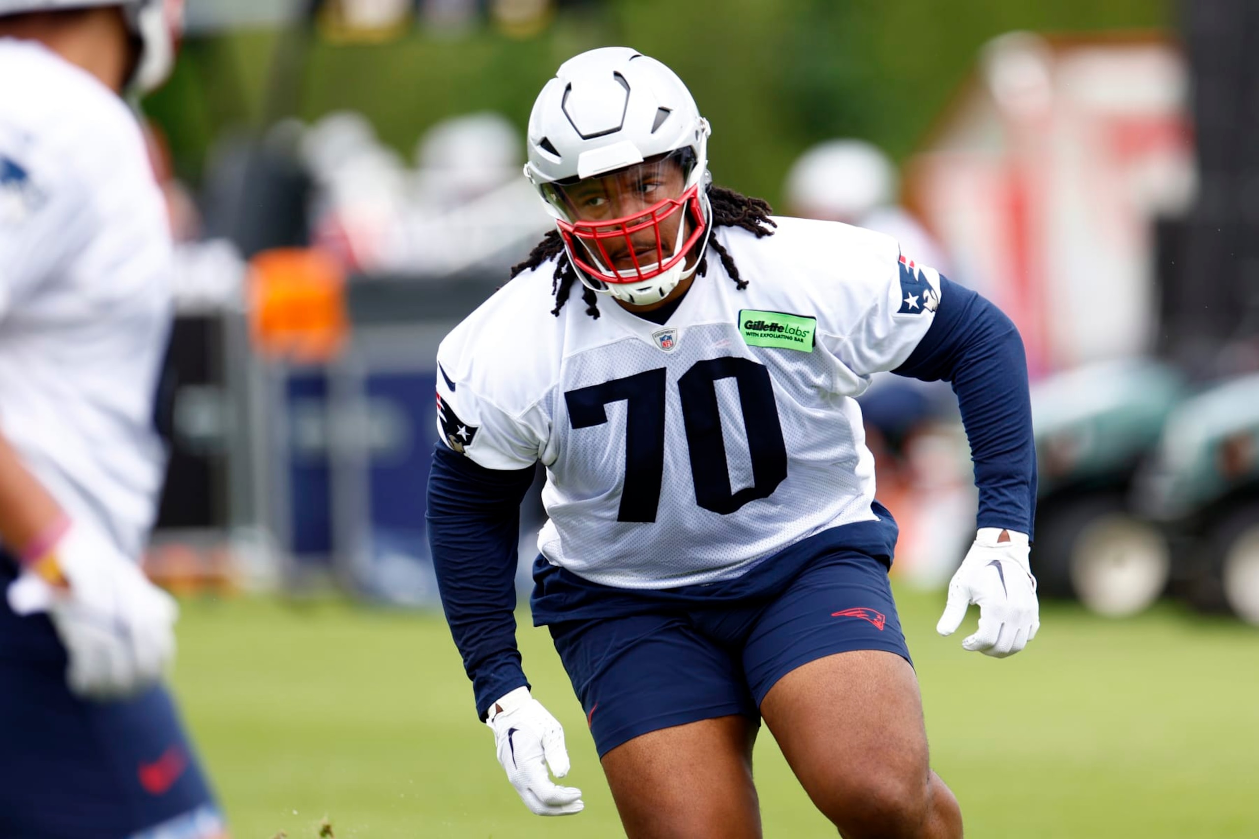 Foxborough, MA - May 29: New England Patriots rookie tackle Caedan Wallace runs drills during OTAs at the Gillette Stadium practice field. (Photo by Danielle Parhizkaran/The Boston Globe via Getty Images)