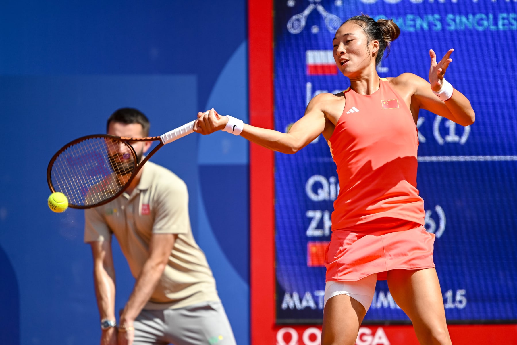 Qinwen Zheng of China controls the Ball during the Women's Singles Semi-final match between Iga Swiatek of Poland and Qinwen Zheng of China on Day 6 of the Olympic Games Paris 2024 at Roland-Garros Stadium on August 1, 2024 in Paris, France. (Photo by Harry Langer/DeFodi Images via Getty Images)