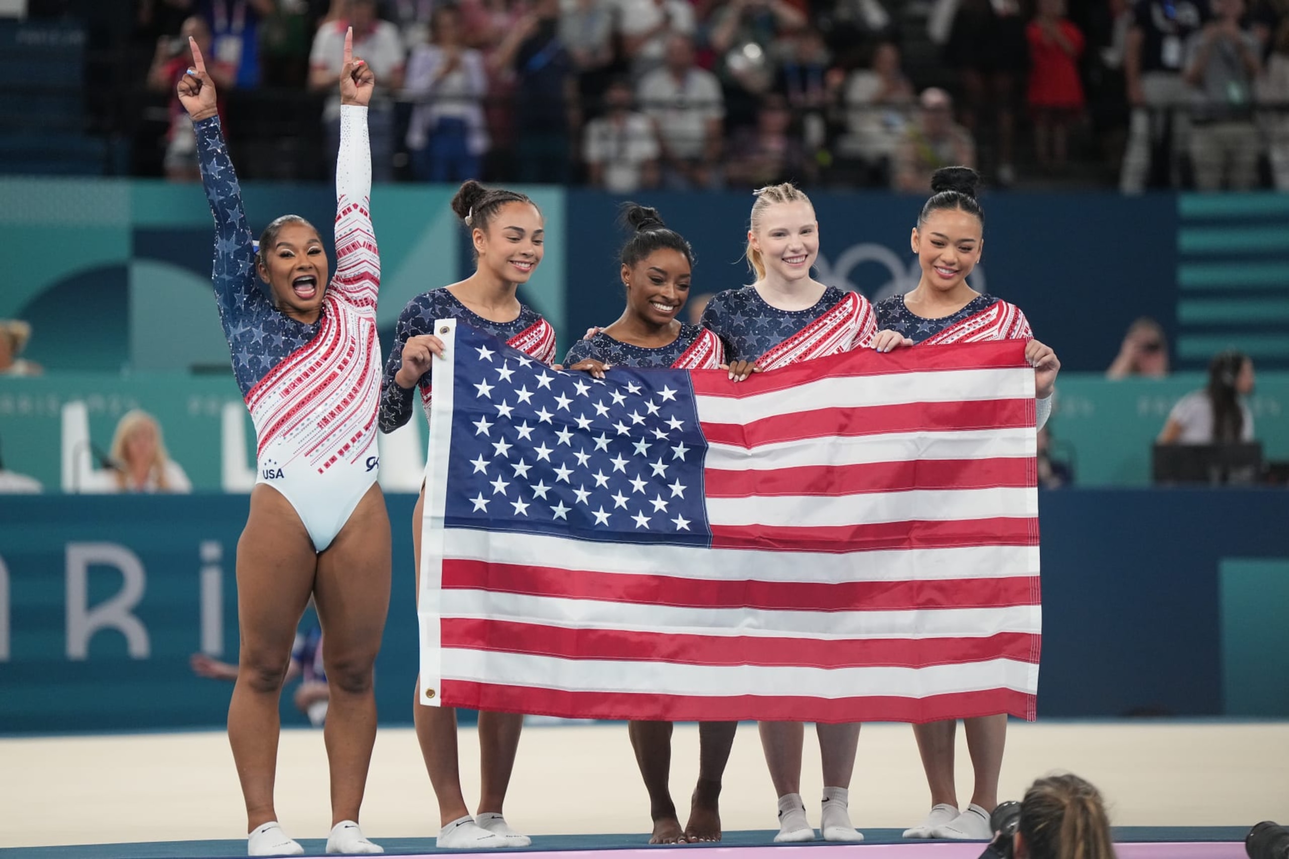 Gymnastics: 2024 Summer Olympics: Team USA Jordan Chiles, Hezly Rivera, Jade Carey, Sunisa Lee and Simone Biles celebrate after winning the gold medal during the Women's team competition final at Bercy Arena.
Paris, France 7/30/2024
CREDIT: Erick W. Rasco (Photo by Eric W. Rasco/Sports Illustrated via Getty Images)
(Set Number: X164561 TK1) Gymnastics: 2024 Summer Olympics: Team USA Jordan Chiles, Hezly Rivera, Jade Carey, Sunisa Lee and Simone Biles celebrate after winning the gold medal during the Women's team competition final at Bercy Arena.
Paris, France 7/30/2024
CREDIT: Erick W. Rasco (Photo by Eric W. Rasco/Sports Illustrated via Getty Images)
(Set Number: X164561 TK1)