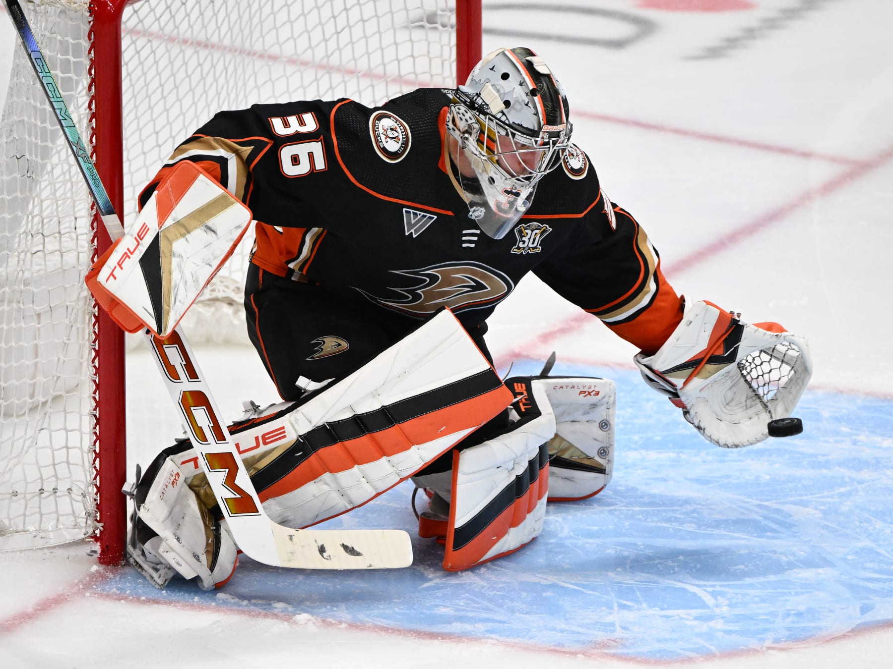 ANAHEIM, CA - APRIL 12: Anaheim Ducks goalie John Gibson (36) blocks a shot during an NHL hockey game against the Calgary Flames played on April 12, 2024 at the Honda Center in Anaheim, CA. (Photo by John Cordes/Icon Sportswire via Getty Images)