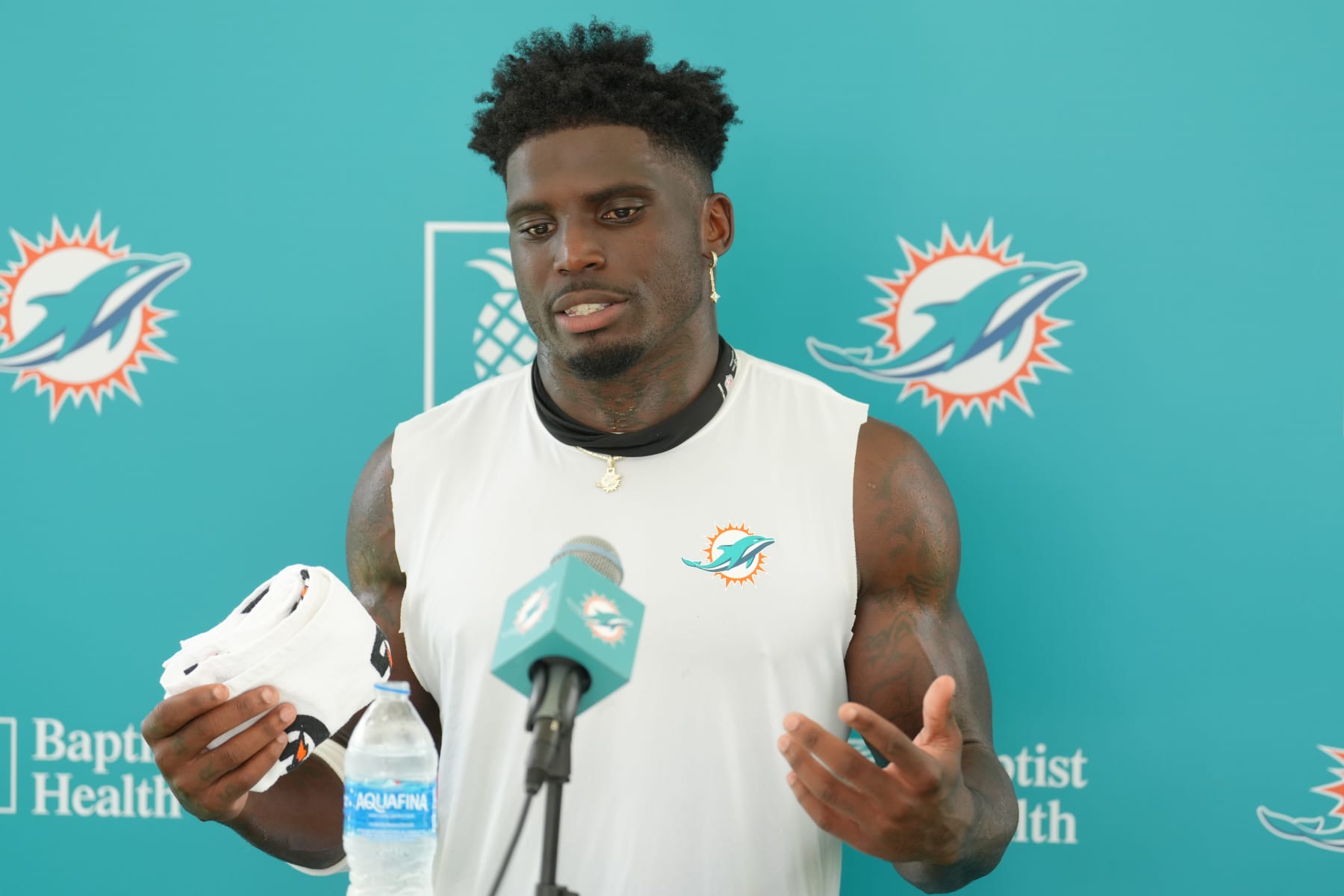 MIAMI GARDENS, FL - AUGUST 01: Miami Dolphins wide receiver Tyreek Hill (10) answers reports asking about his contract during Dolphins Training Camp on Thursday, August 1, 2024 at Baptist Health Training Complex in Miami Gardens, Fla. (Photo by Peter Joneleit/Icon Sportswire via Getty Images)