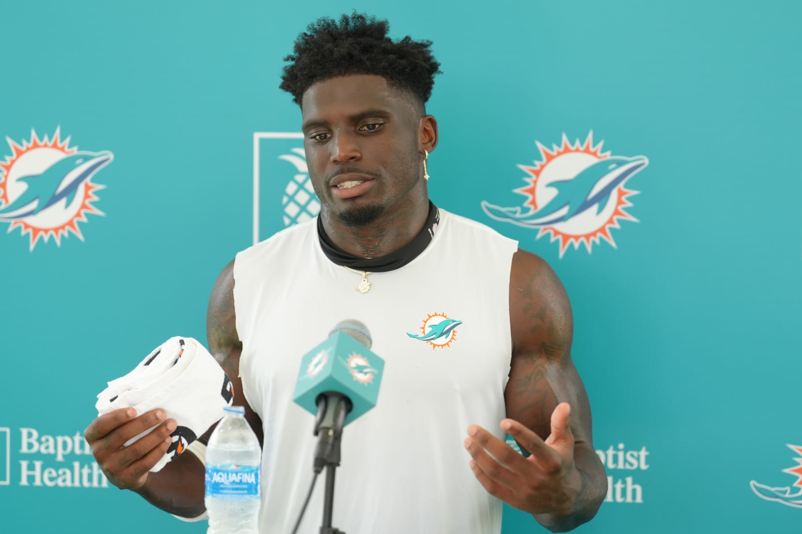 MIAMI GARDENS, FL - AUGUST 01: Miami Dolphins wide receiver Tyreek Hill (10) answers reports asking about his contract during Dolphins Training Camp on Thursday, August 1, 2024 at Baptist Health Training Complex in Miami Gardens, Fla. (Photo by Peter Joneleit/Icon Sportswire via Getty Images)