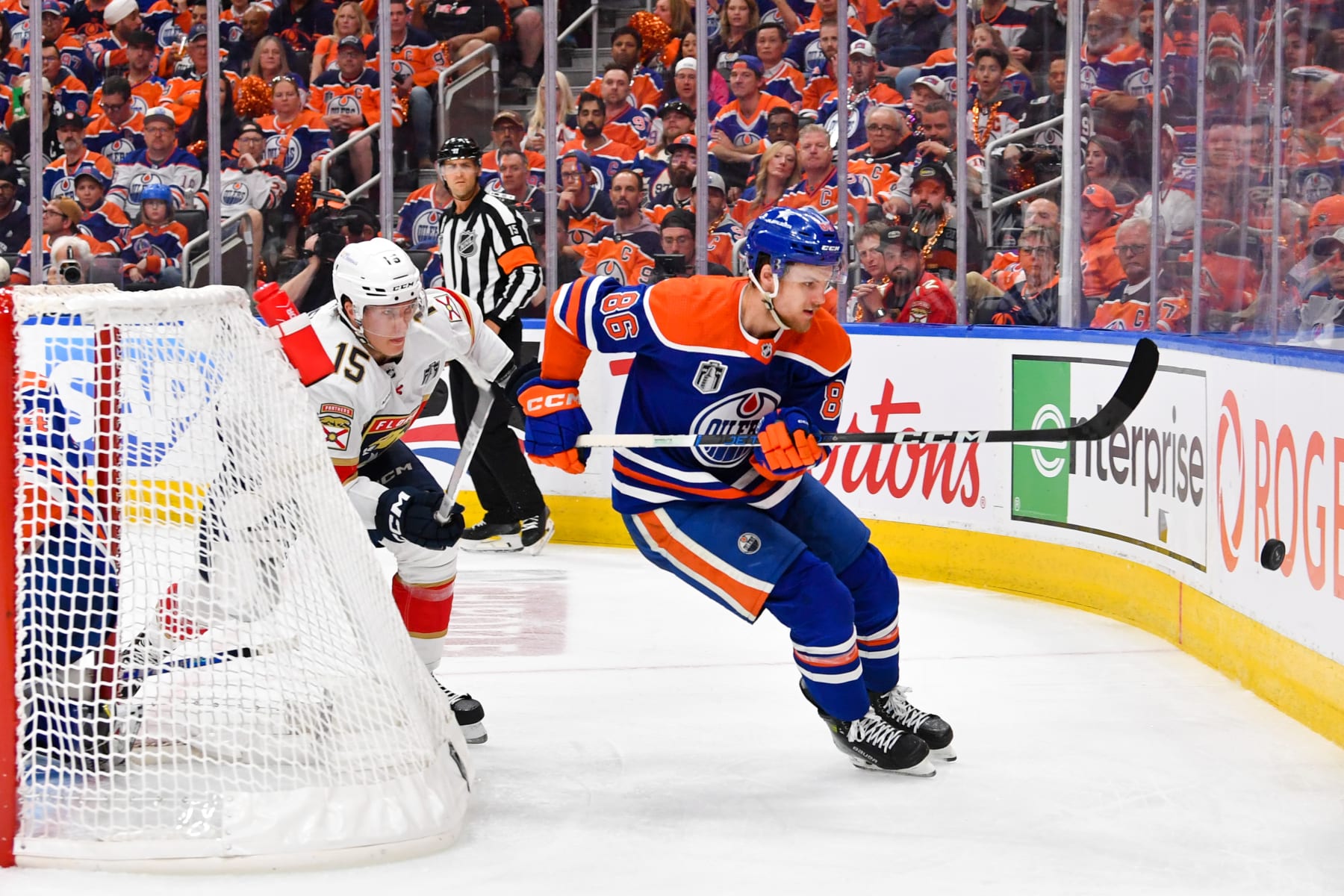 EDMONTON, CANADA - JUNE 21: Philip Broberg #86 of the Edmonton Oilers battles for the puck against Anton Lundell #15 of the Florida Panthers in Game Six of the 2024 Stanley Cup Final at Rogers Place on June 21, 2024, in Edmonton, Alberta, Canada. (Photo by Andy Devlin/NHLI via Getty Images)