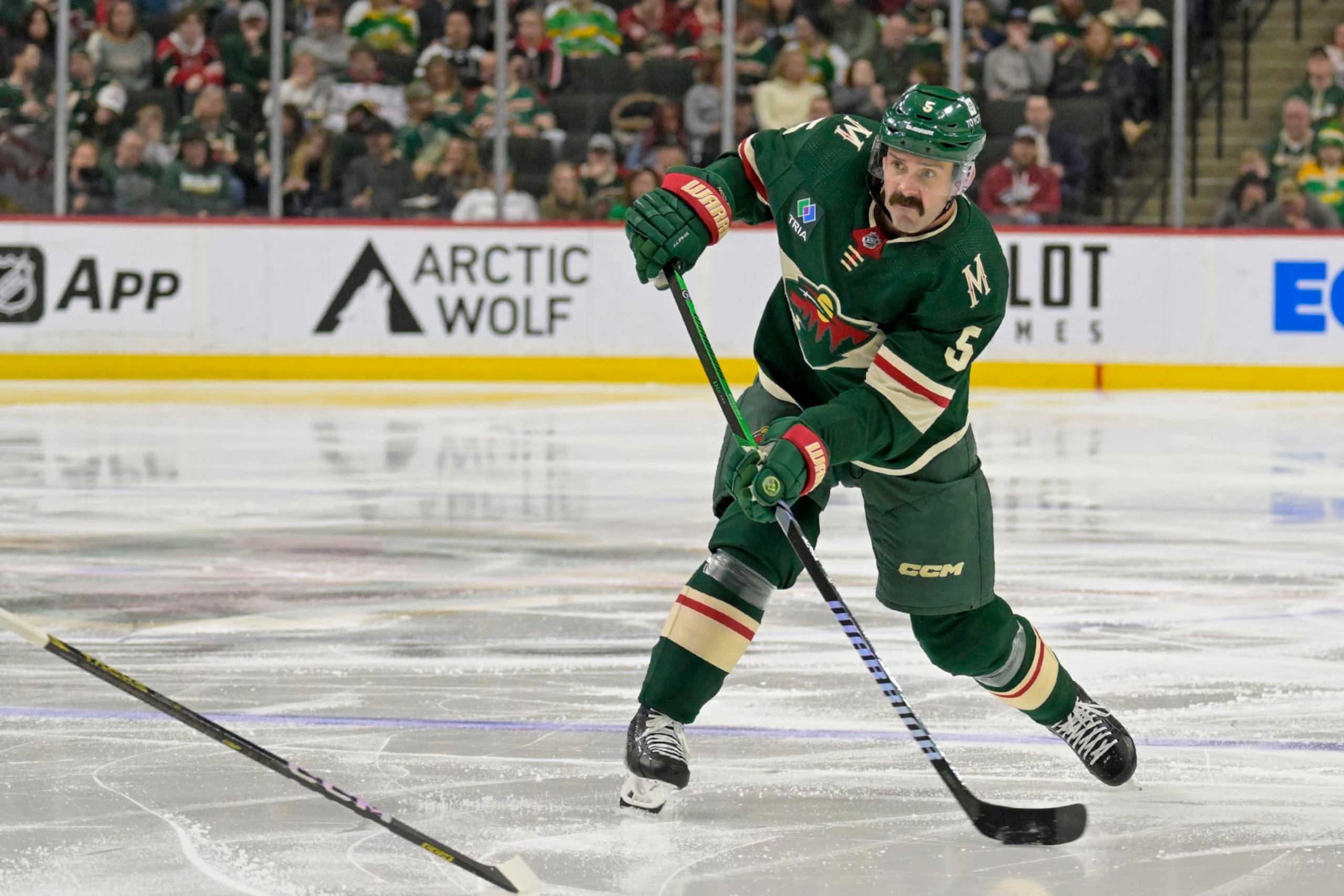 ST. PAUL, MINNESOTA - MARCH 03: Jacob Middleton #5 of the Minnesota Wild takes a shot on goal against the San Jose Sharks during the second period at Excel Energy Center on March 03, 2024 in St. Paul, Minnesota. The Wild defeated the Sharks 4-3. (Photo by Nick Wosika/Getty Images)