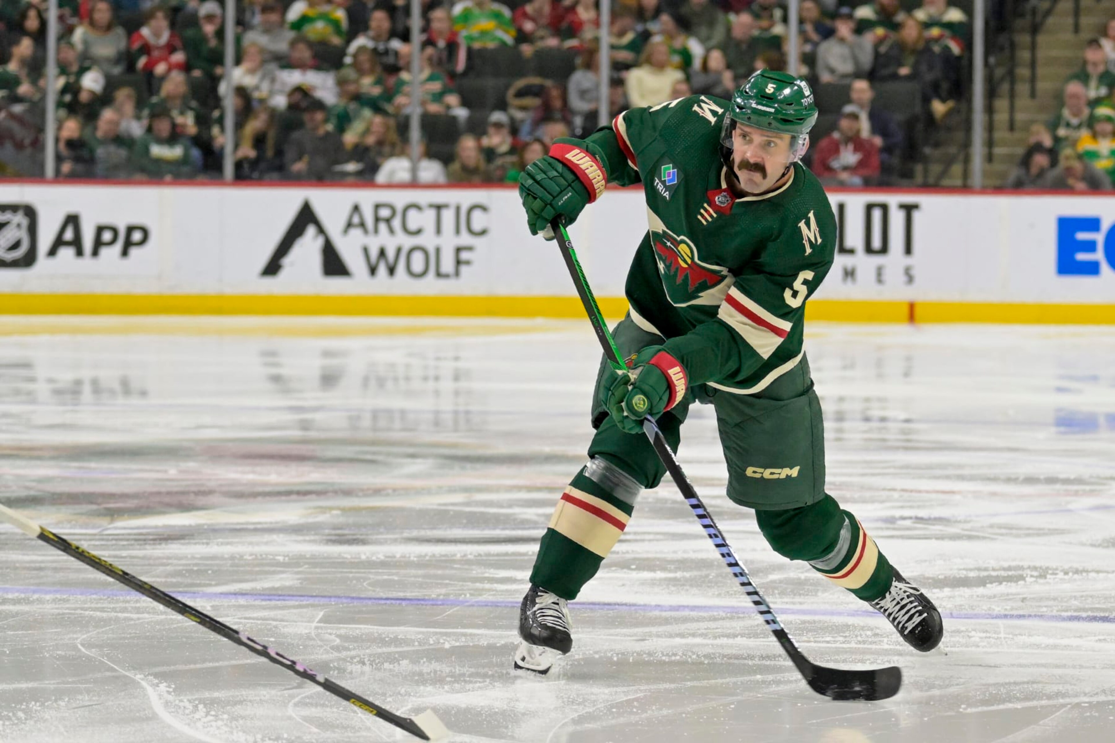 ST. PAUL, MINNESOTA - MARCH 03: Jacob Middleton #5 of the Minnesota Wild takes a shot on goal against the San Jose Sharks during the second period at Excel Energy Center on March 03, 2024 in St. Paul, Minnesota. The Wild defeated the Sharks 4-3. (Photo by Nick Wosika/Getty Images)