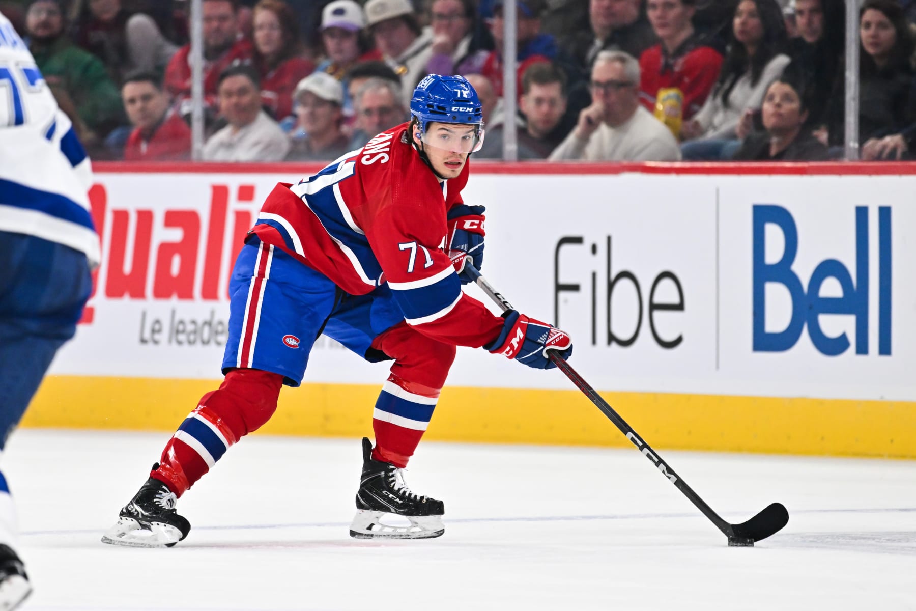 MONTREAL, CANADA - APRIL 04:  Jake Evans #71 of the Montreal Canadiens skates the puck during the second period against the Tampa Bay Lightning at the Bell Centre on April 4, 2024 in Montreal, Quebec, Canada.  The Tampa Bay Lightning defeated the Montreal Canadiens 7-4.  (Photo by Minas Panagiotakis/Getty Images)