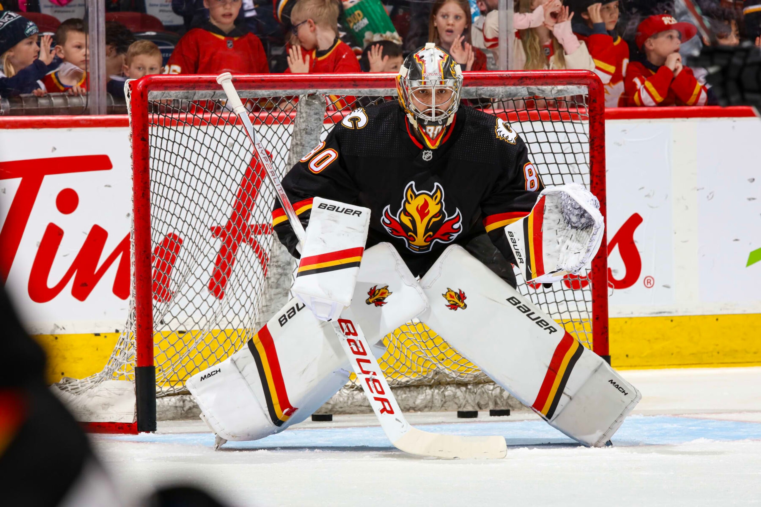 CALGARY, AB - MARCH 14: Dan Vladar #80 of the Calgary Flames skates warms up against the Vegas Golden Knights at Scotiabank Saddledome on March 14, 2024 in Calgary, Alberta, Canada. (Photo by Gerry Thomas/NHLI via Getty Images)